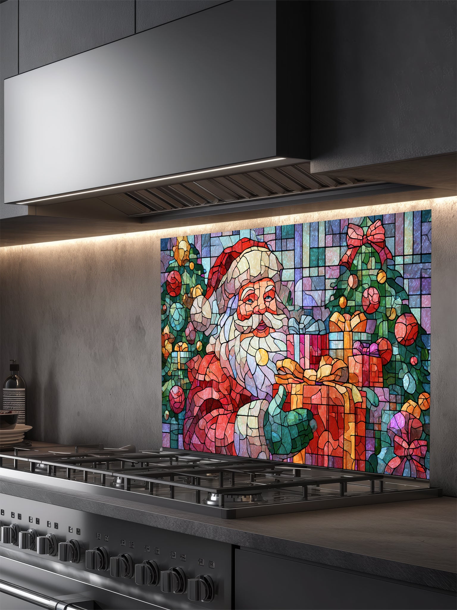Tempered glass kitchen backsplash featuring a highly realistic 3D illusion of mosaic stained glass art showing a cheerful Santa Claus holding a wrapped gift, surrounded by green Christmas trees and colorful presents against a tiled blue and purple background, installed behind a modern black stove.