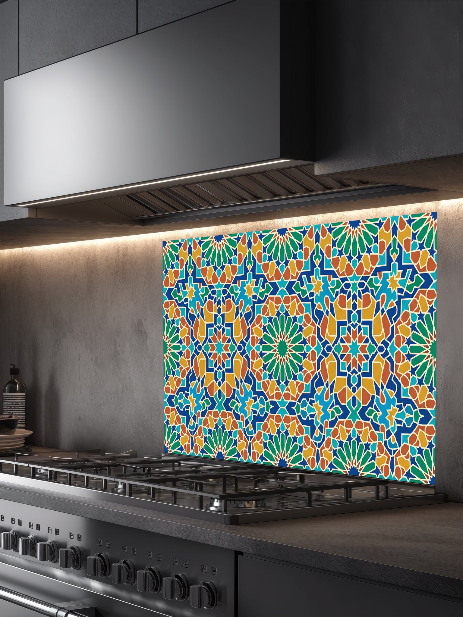 Colorful geometric patterned backsplash above a stove in a kitchen.