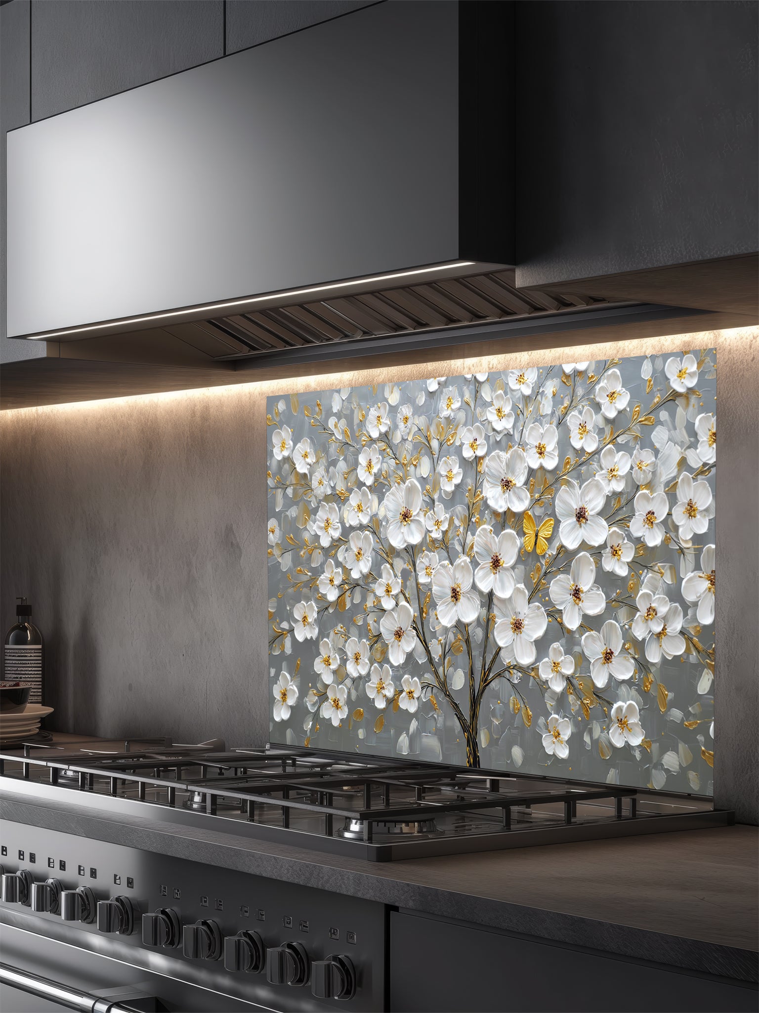 "Faux 3D impasto style painting of a white floral tree with golden accents and a yellow butterfly on a grey background, UV printed on a smooth tempered glass kitchen backsplash."