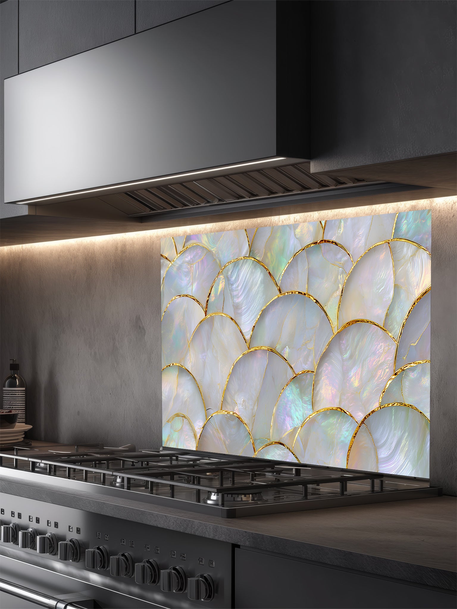 Kitchen with a decorative glass splashback featuring a shell pattern.