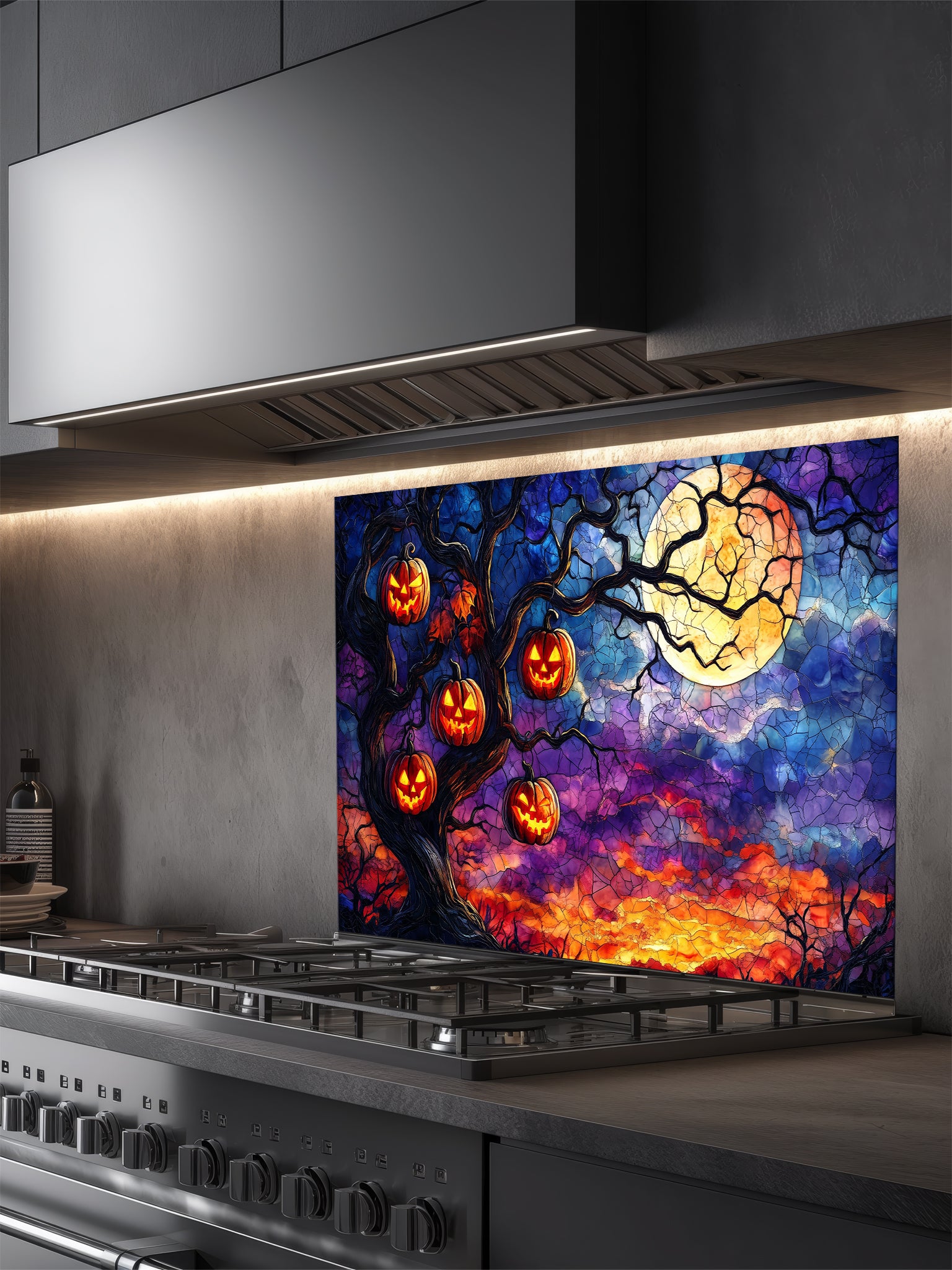 Colorful Halloween-themed glass splashback behind a kitchen stove