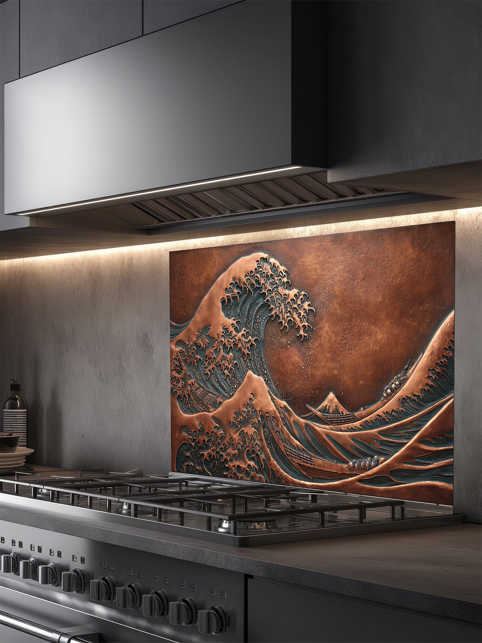 Tempered glass kitchen backsplash featuring a highly realistic 3D faux copper metal relief design of the iconic Great Wave off Kanagawa and Mount Fuji, installed behind a modern stainless steel stove.