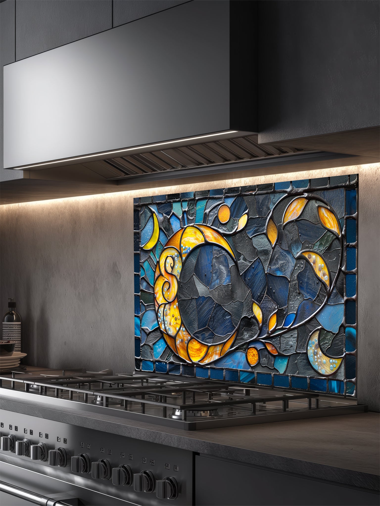 Tempered glass kitchen backsplash featuring a highly realistic 3D illusion of an abstract mosaic moon glowing in amber and gold against a swirling midnight blue and charcoal background, installed behind a modern black stove.