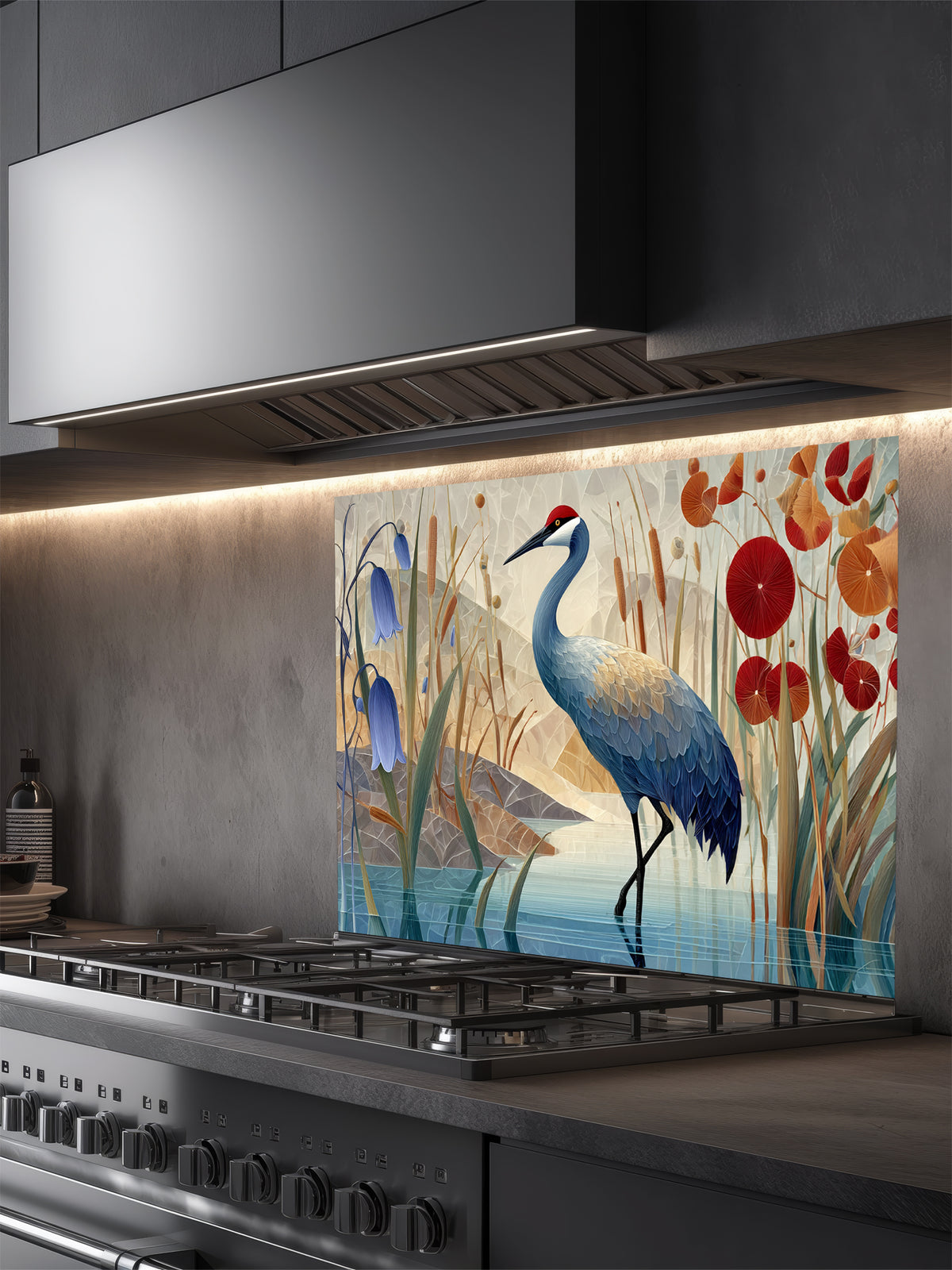 Tempered glass kitchen backsplash featuring a crisp, modern Japandi-style illustration of a majestic red-crowned crane standing in tranquil water among bluebell flowers and red botanical accents against a geometric beige mountain background, installed behind a modern black stove.