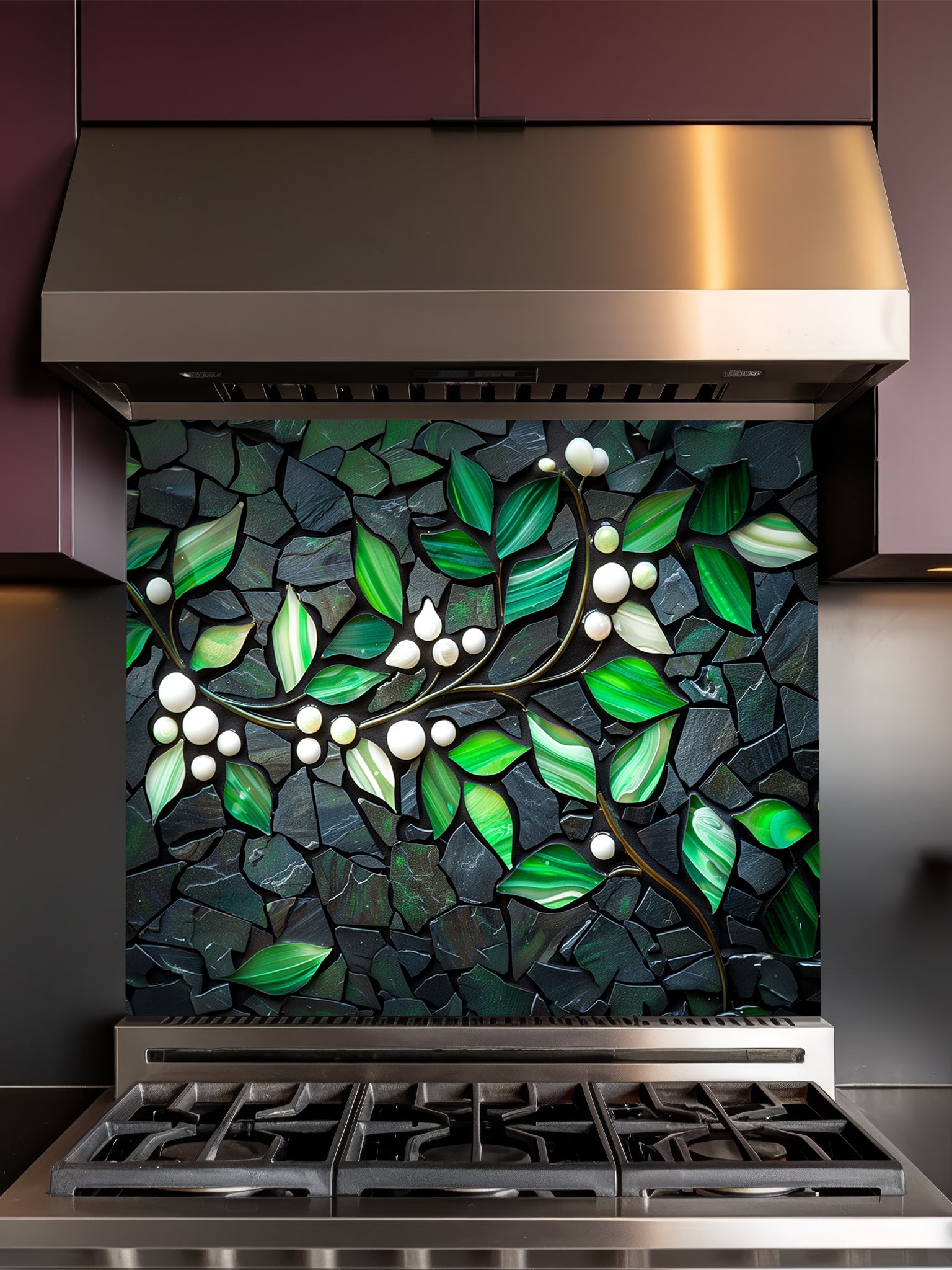 Tempered glass kitchen backsplash featuring a highly realistic 3D illusion of a stone mosaic showcasing vibrant emerald green agate-like leaves and white pearl berries on a glowing golden branch against a dark charcoal stone background, installed behind a modern black stove.