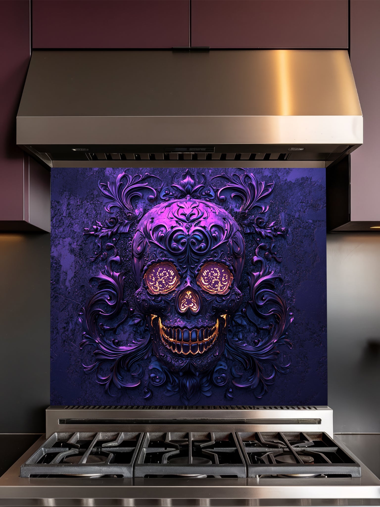 Tempered glass kitchen backsplash featuring a highly realistic 3D illusion of an embossed, intricately carved gothic skull with glowing gold eyes and teeth, surrounded by dark purple baroque filigree swirls, installed behind a modern black stove.