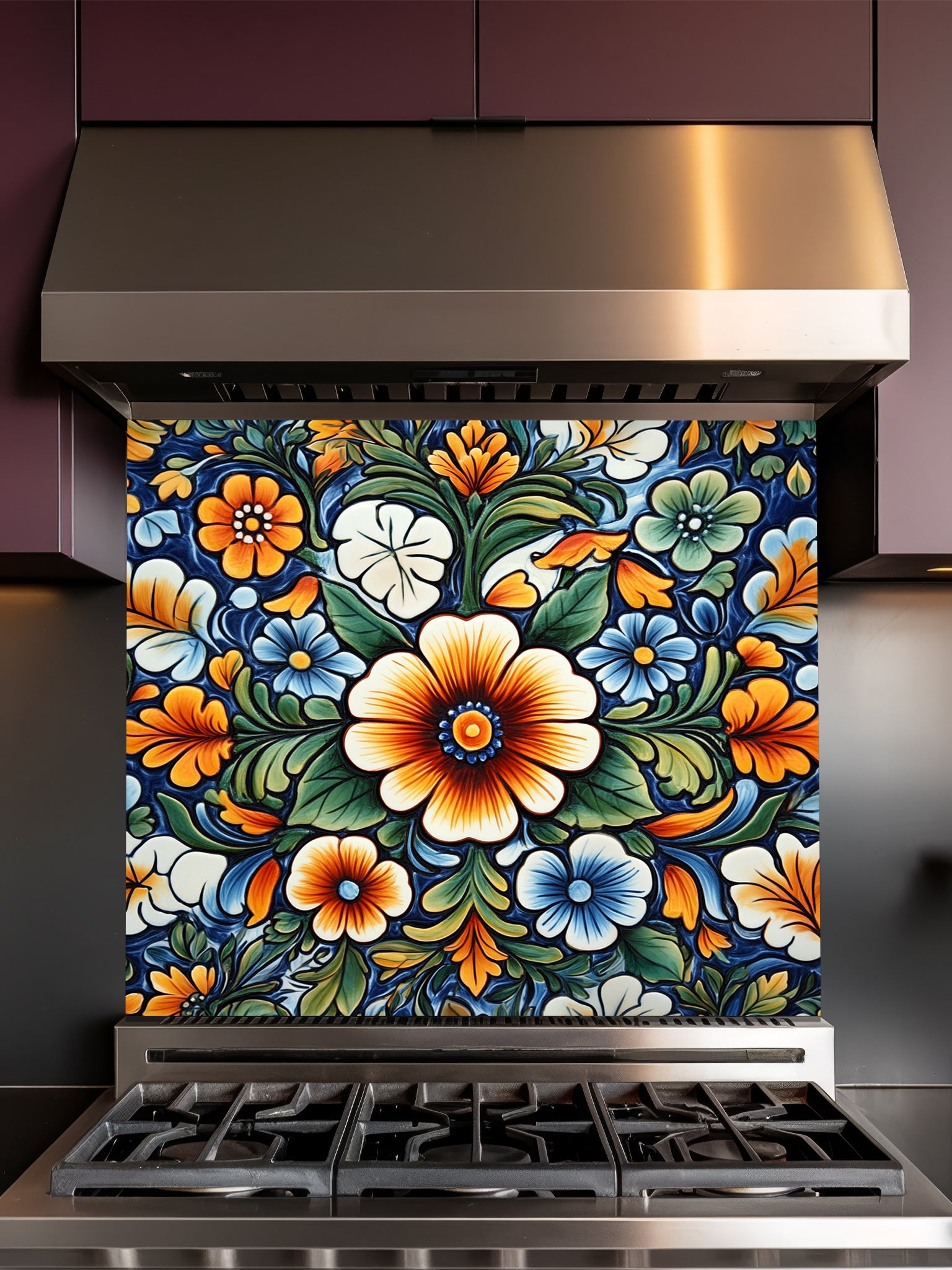 Vibrant Mexican Talavera style floral pattern in blue, orange, and green, UV printed on a smooth tempered glass kitchen backsplash, installed behind a modern stove.