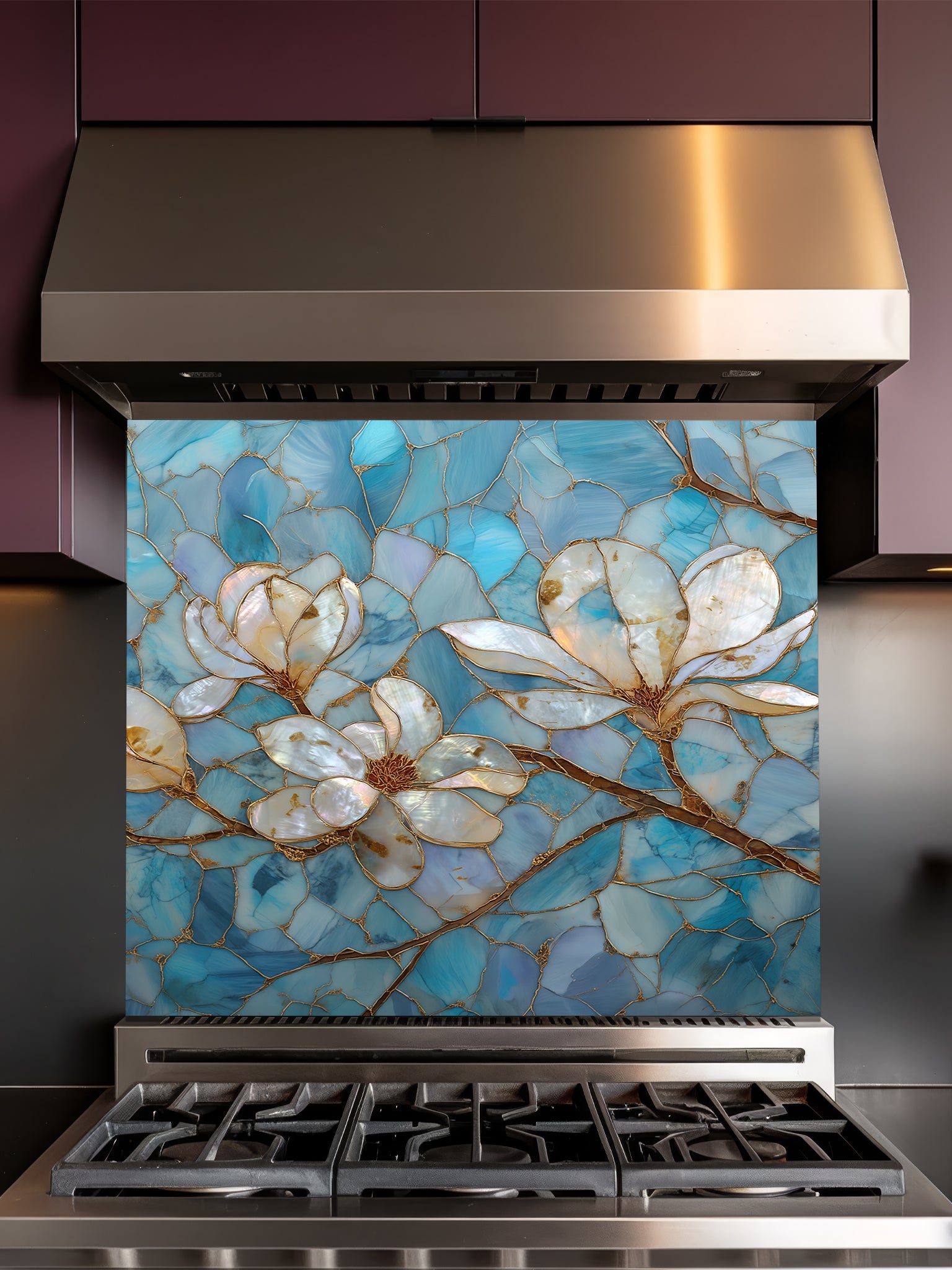Stained glass style white magnolia flowers with gold veining on a beautiful cracked blue agate background, UV printed on a smooth tempered glass kitchen backsplash, installed behind a modern stove.