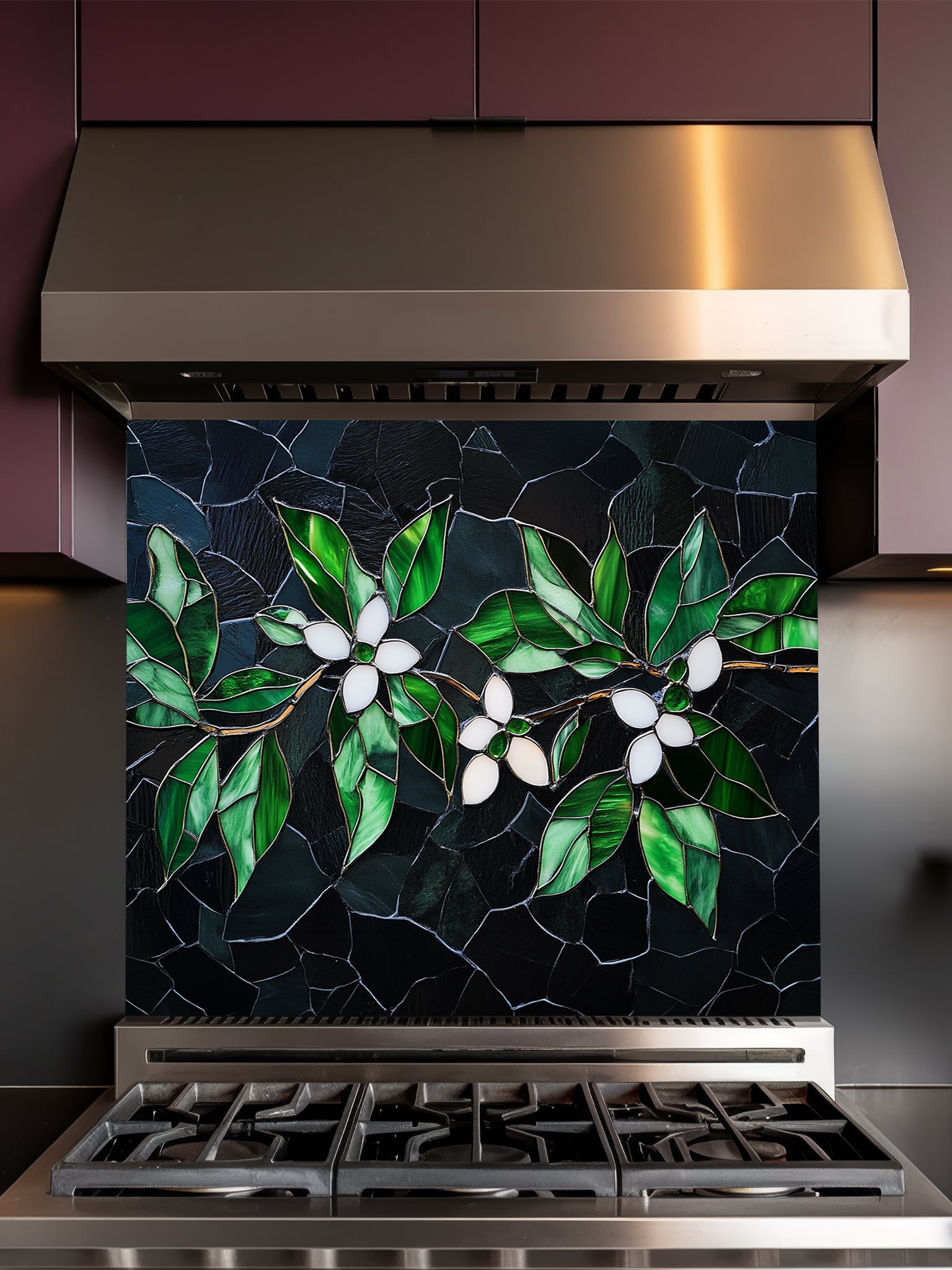 Tempered glass kitchen backsplash featuring a highly realistic 3D illusion of stained glass and cracked mosaic art showing delicate white blossoms and vibrant emerald green leaves gracefully sprawling across a dark, moody charcoal and black background, installed behind a modern black stove.