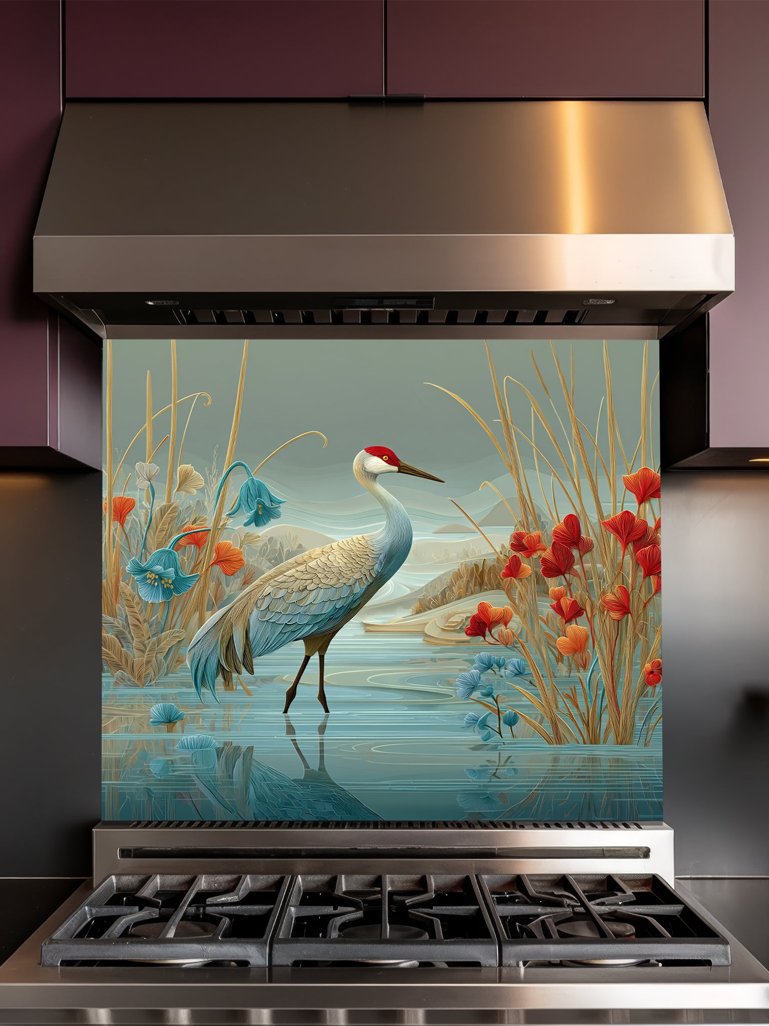 Tempered glass kitchen backsplash featuring a highly realistic illustrative design of a majestic crane standing in water among stylized red poppies and bluebell flowers against a sage green sky, installed behind a modern black stove.