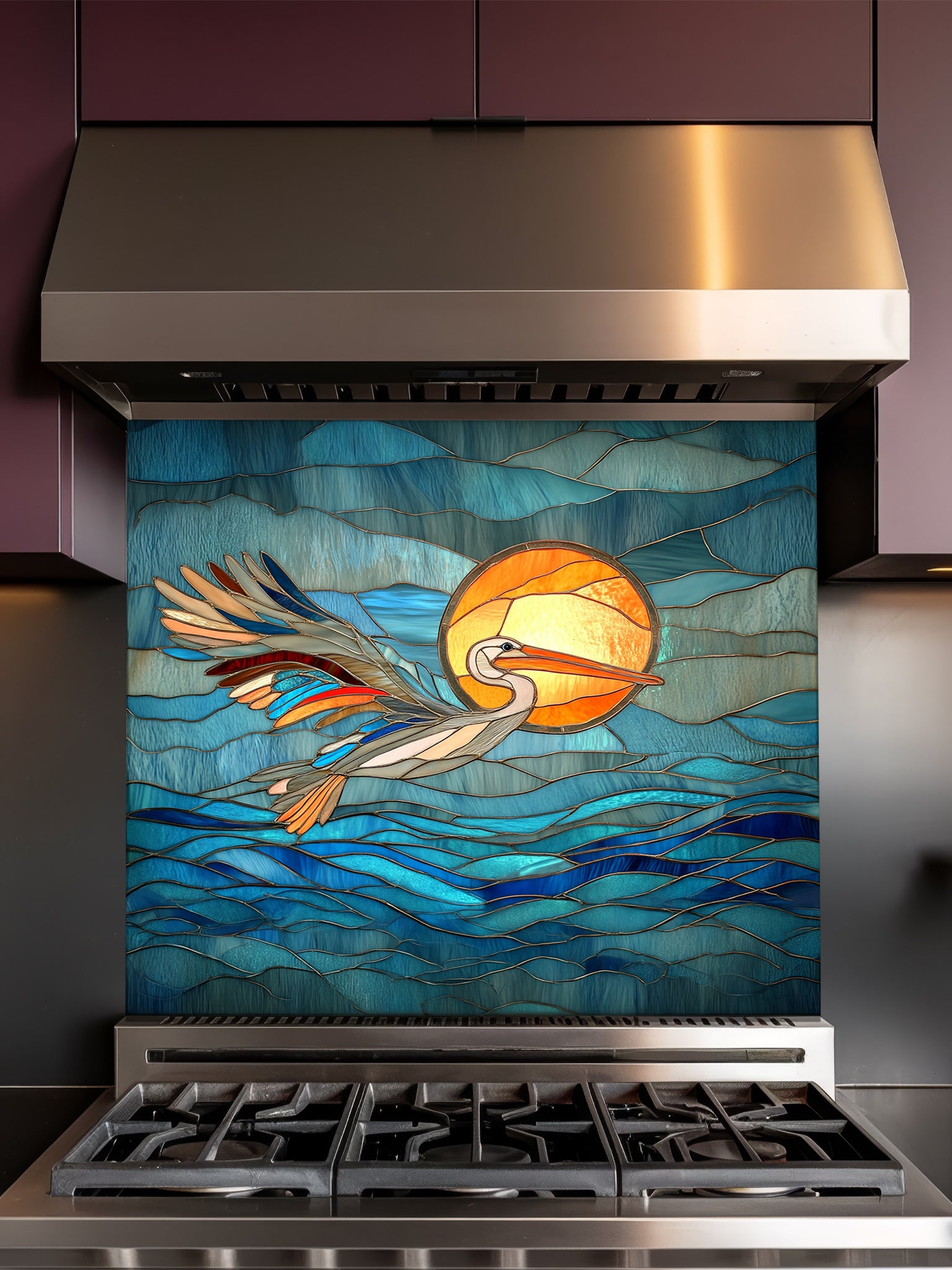 Stained glass style pelican flying over blue ocean waves and a bright sun, UV printed on tempered glass kitchen backsplash, installed behind a modern stove.