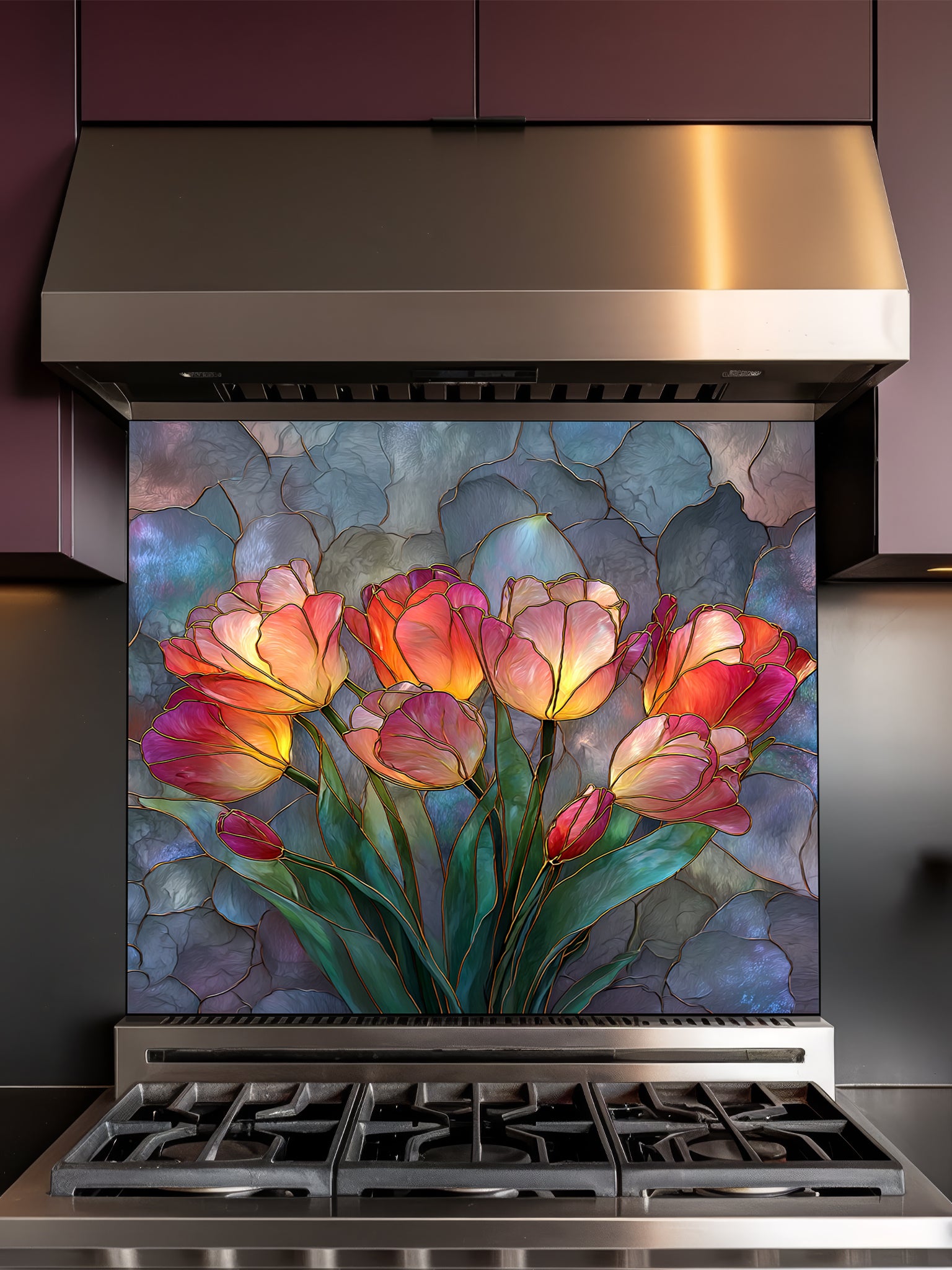 Stained glass style blooming tulips in vibrant red, orange, yellow, and pink on a textured blue background, UV printed on a smooth tempered glass kitchen backsplash, installed behind a modern stove.