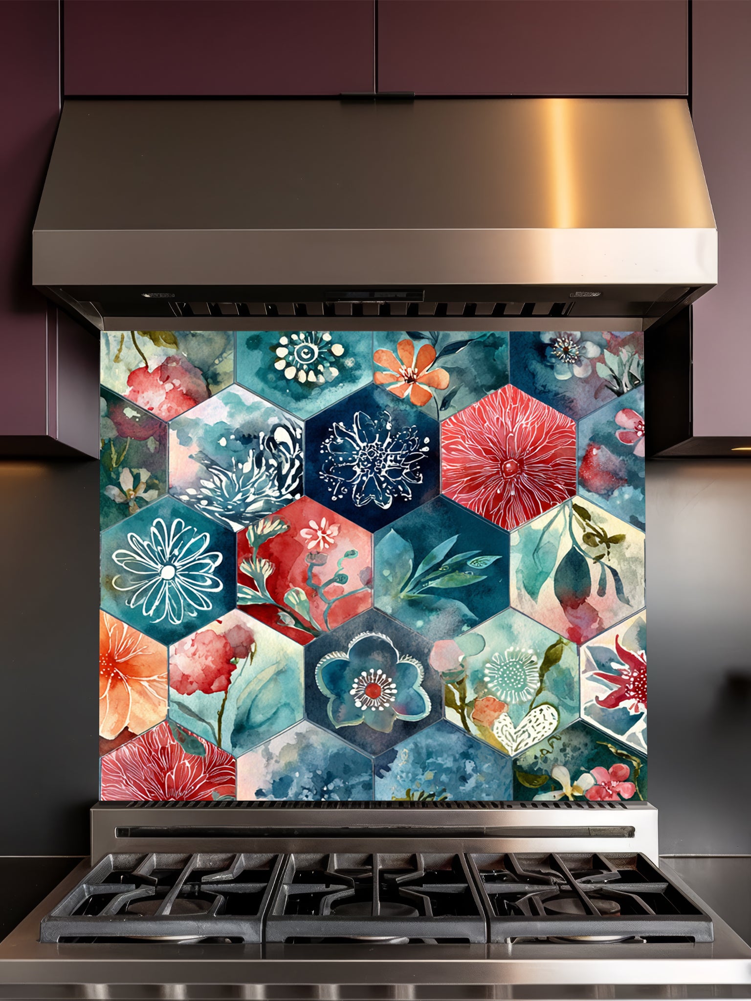 Tempered glass kitchen backsplash featuring a highly realistic illusion of geometric hexagon tiles showcasing delicate, hand-painted style watercolor floral patterns in navy blue, teal, coral red, and peach, installed behind a modern black stove.