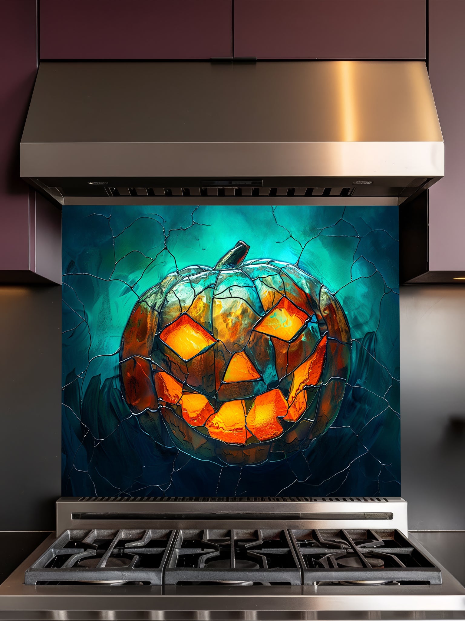 Tempered glass kitchen backsplash featuring a highly realistic 3D illusion of stained glass art showing a spooky Jack-o'-lantern pumpkin with glowing fiery orange eyes and mouth against a dark teal cracked glass background, installed behind a modern black stove.