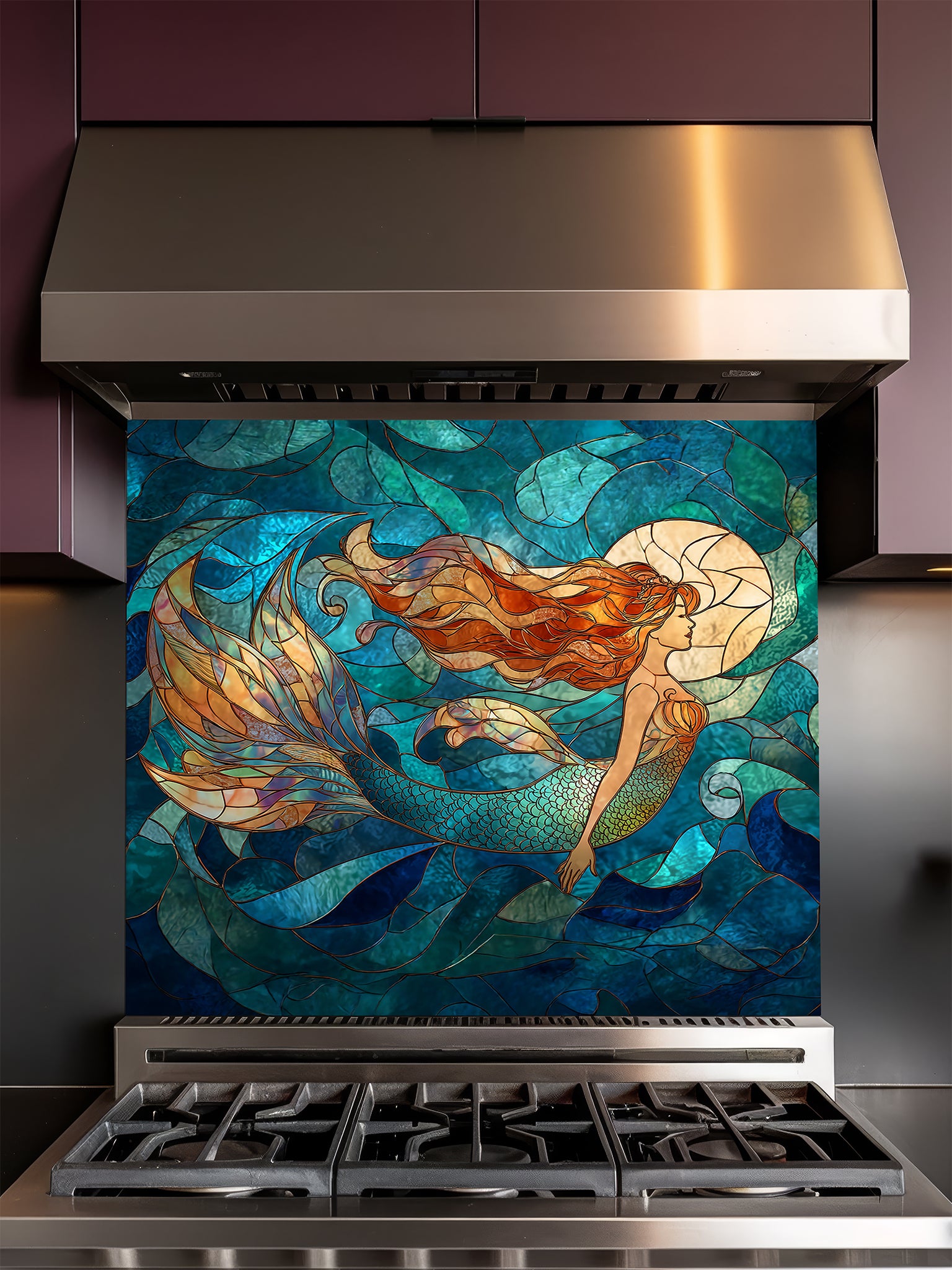 Tempered glass kitchen backsplash featuring a vibrant faux stained glass design of a graceful mermaid with flowing hair swimming in a blue ocean under a glowing moon, installed behind a modern stainless steel stove.