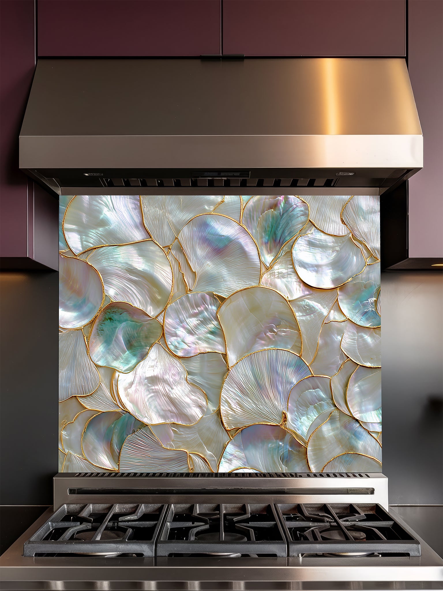 Tempered glass kitchen backsplash featuring a highly realistic 3D faux mosaic design of overlapping mother of pearl and abalone shells with iridescent pastel colors and gold outlines, installed behind a modern stainless steel stove.