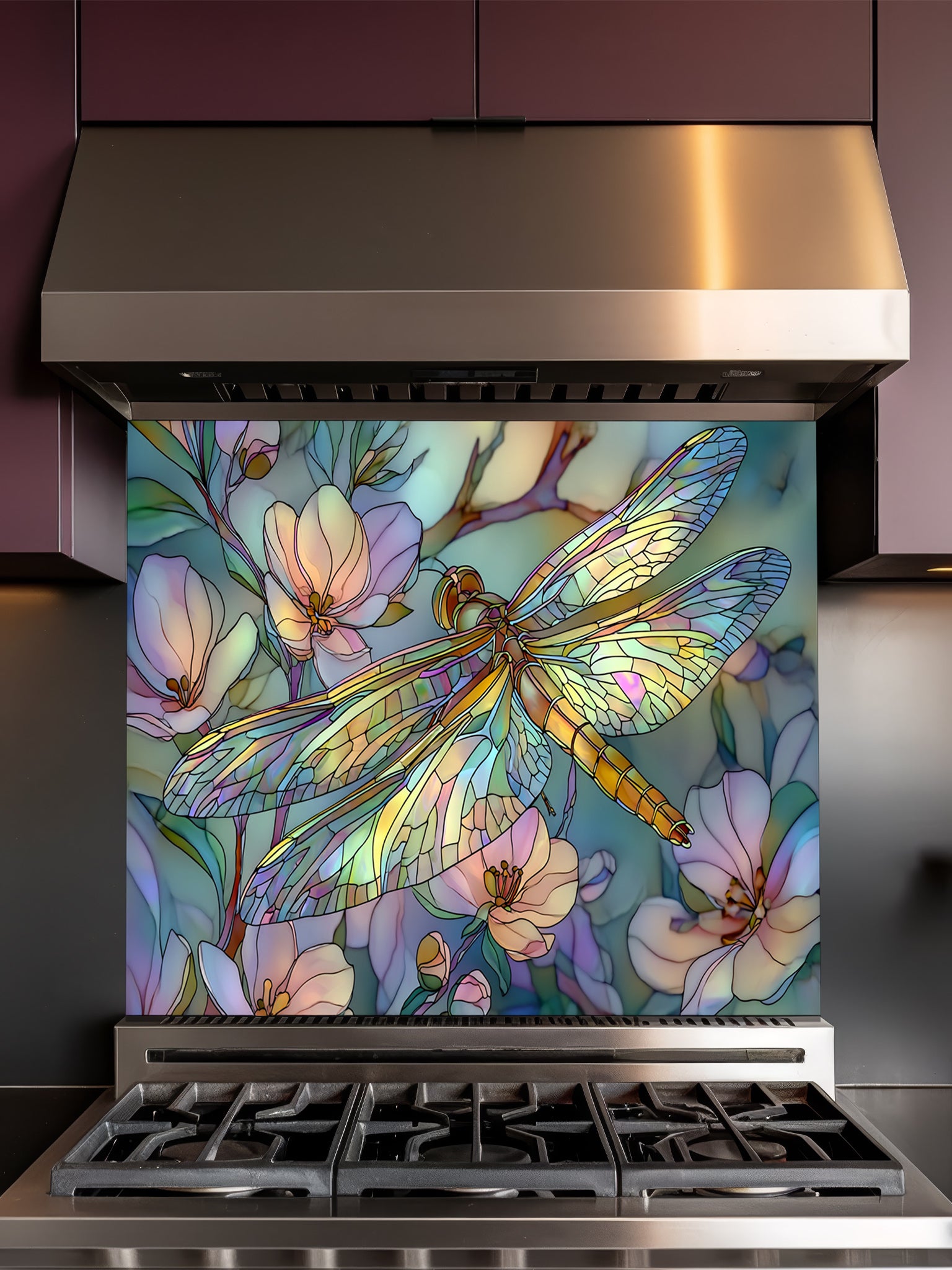 Tempered glass kitchen backsplash featuring a highly realistic 3D illusion of Art Nouveau stained glass showing an elegant dragonfly with iridescent translucent wings resting among soft pastel pink and mint green blooming flowers, installed behind a modern stainless steel stove.