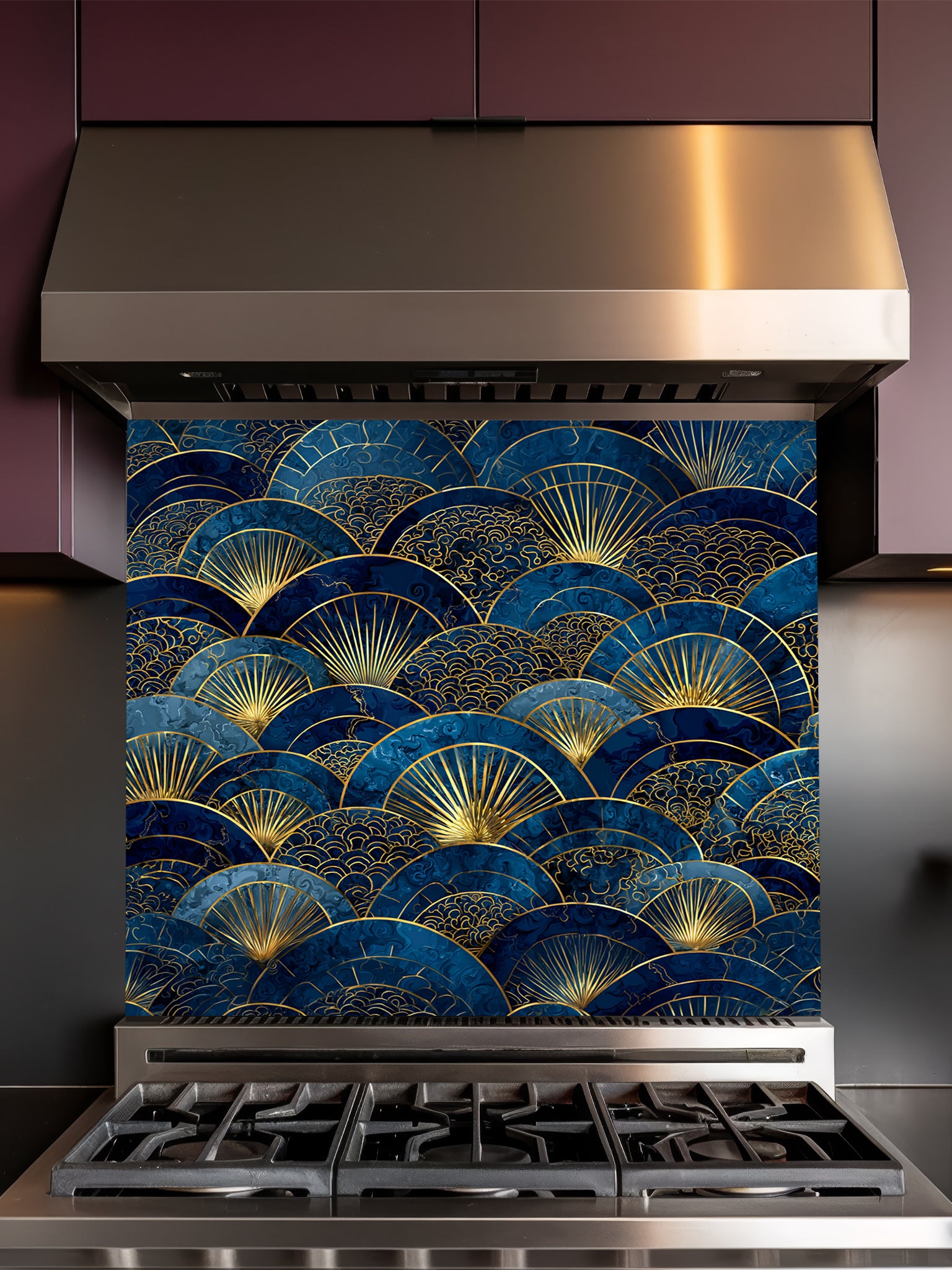 Intricate Japanese Seigaiha wave and Art Deco sunburst fan pattern in deep navy blue and gold, UV printed on a smooth tempered glass kitchen backsplash, installed behind a modern stove.