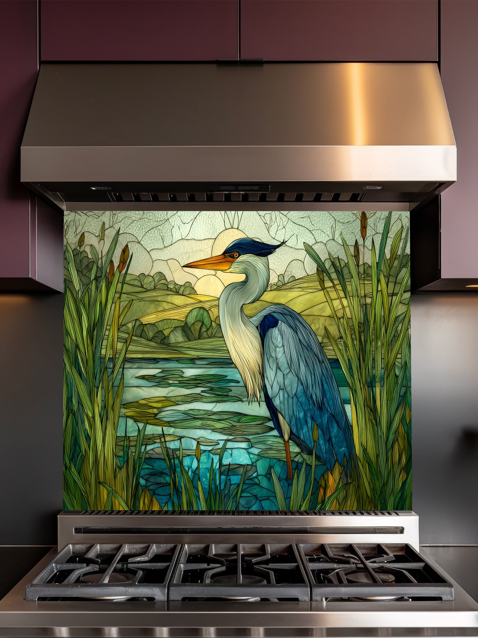 Tempered glass kitchen backsplash featuring a highly realistic 3D illusion of stained glass art showing a majestic blue heron standing in a serene wetland marsh with green cattails and a tranquil lake, installed behind a modern stainless steel stove.
