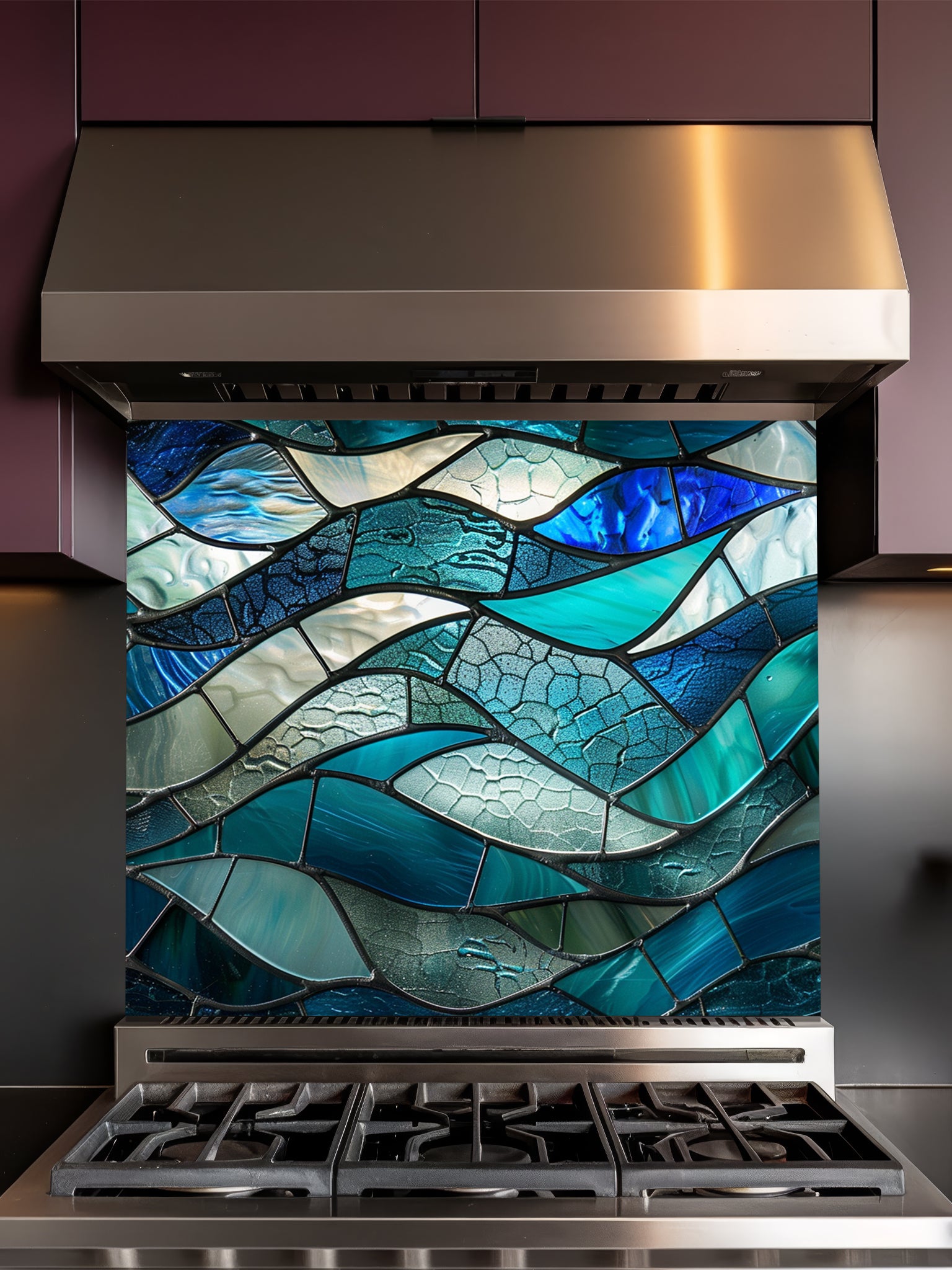 Tempered glass kitchen backsplash featuring a highly realistic 3D illusion of stained glass or sea glass art showing flowing, overlapping ocean waves in vibrant translucent shades of sapphire blue, teal, and aquamarine, installed behind a modern black stove.