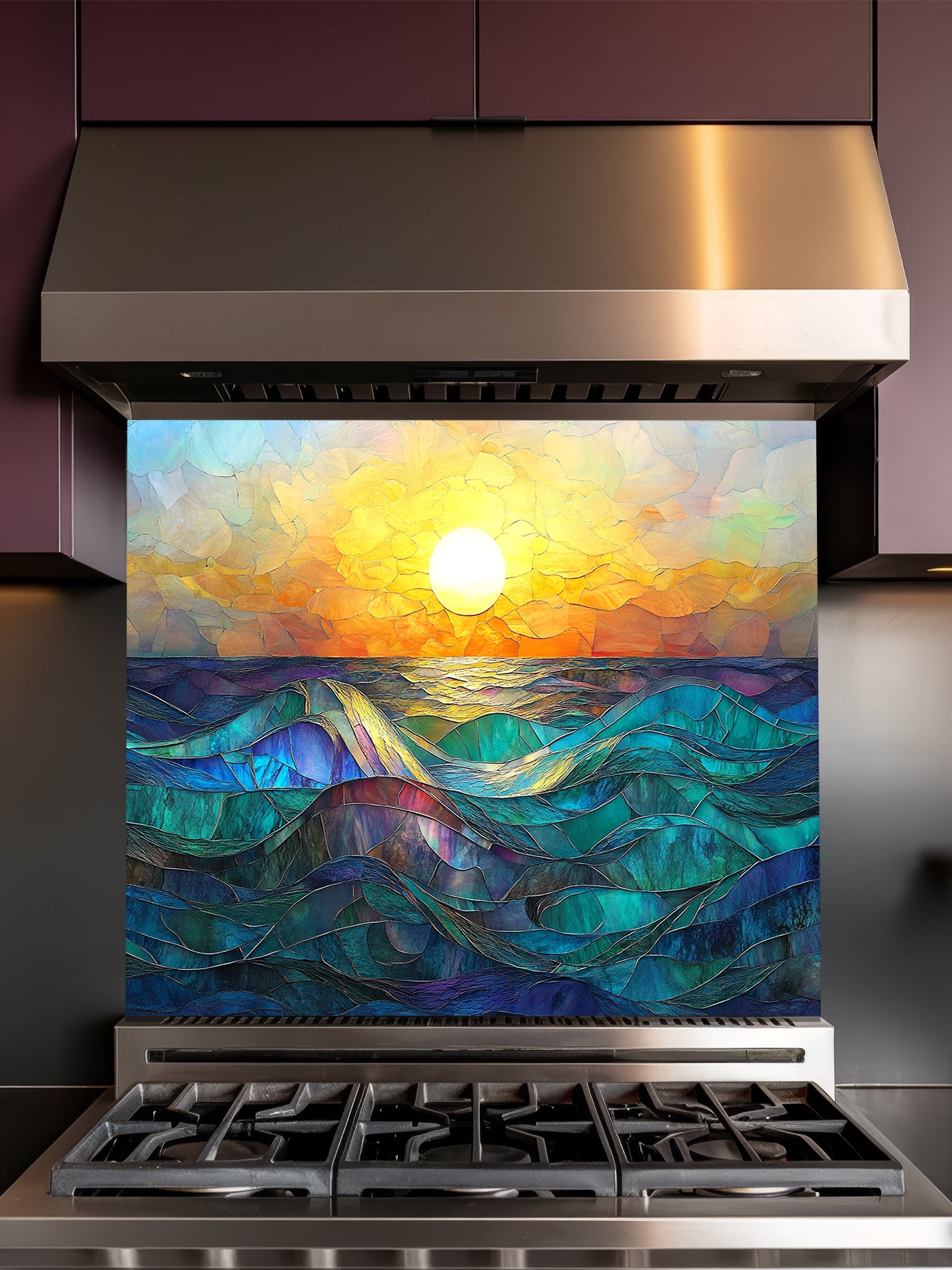 Stainless steel range hood with a decorative glass panel featuring a sunset over water design.