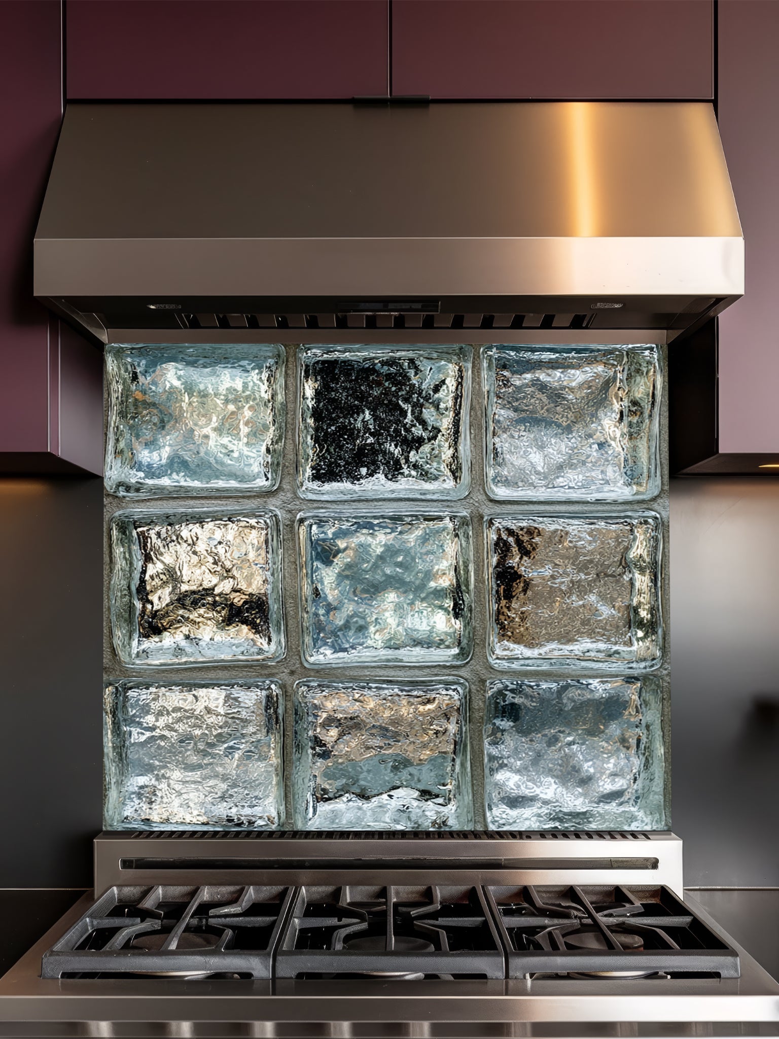 Tempered glass kitchen backsplash featuring a highly realistic 3D illusion of classic architectural clear glass blocks with authentic wavy, ice-like textures and sleek silver-grey reflections, installed behind a modern black stove.