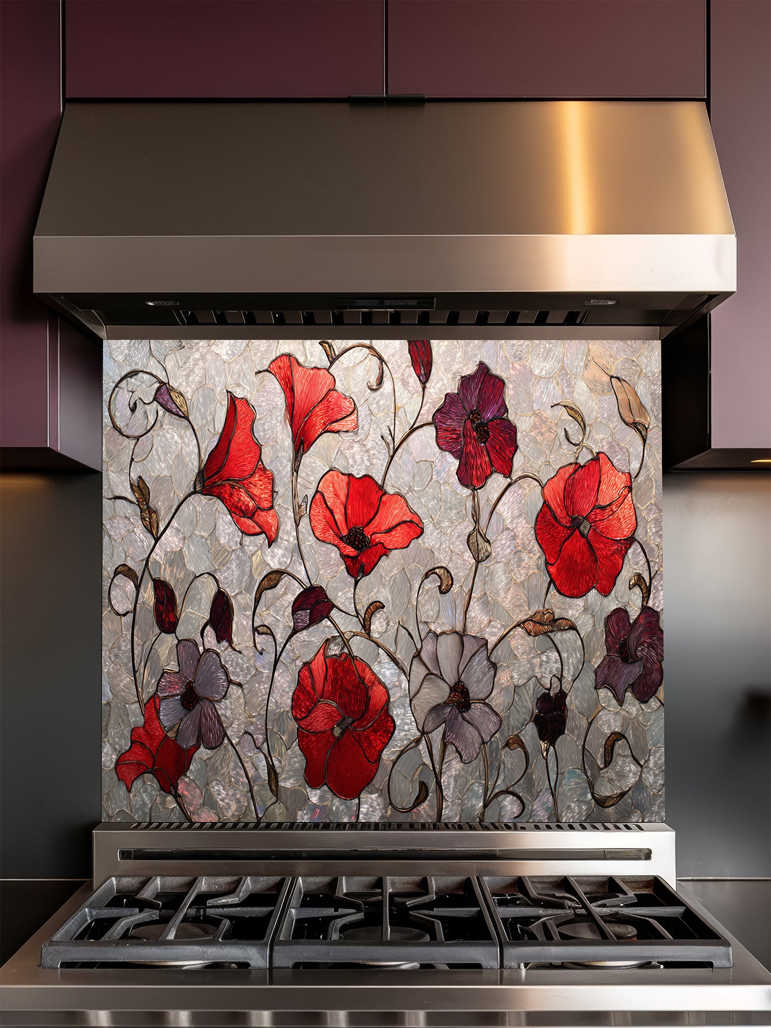 Tempered glass kitchen backsplash featuring a faux stained glass design of vibrant red and purple poppy flowers with elegant curving stems against a textured silver mosaic background, installed behind a modern stainless steel stove.