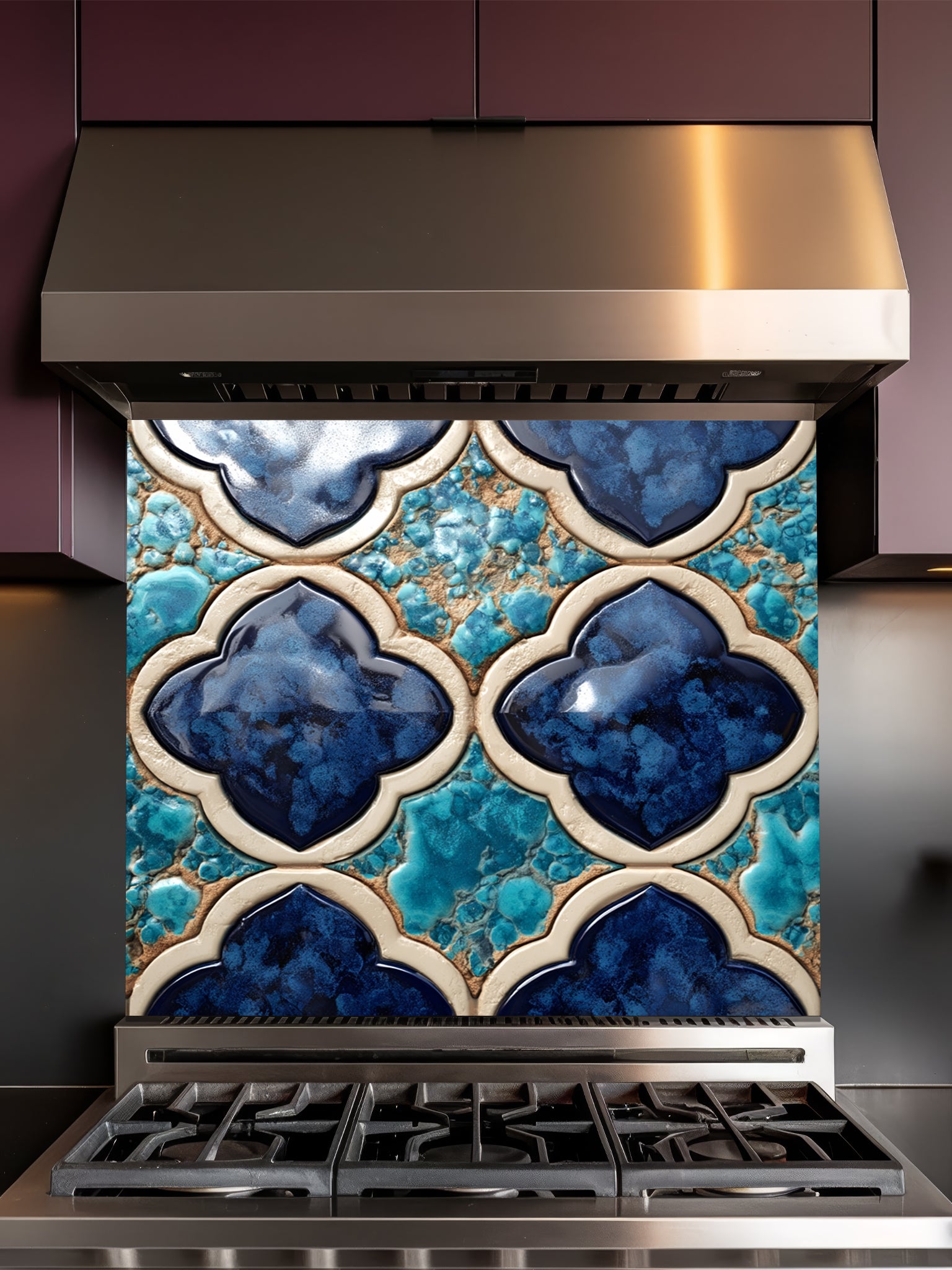 Stainless steel range hood with decorative blue and turquoise tile backsplash