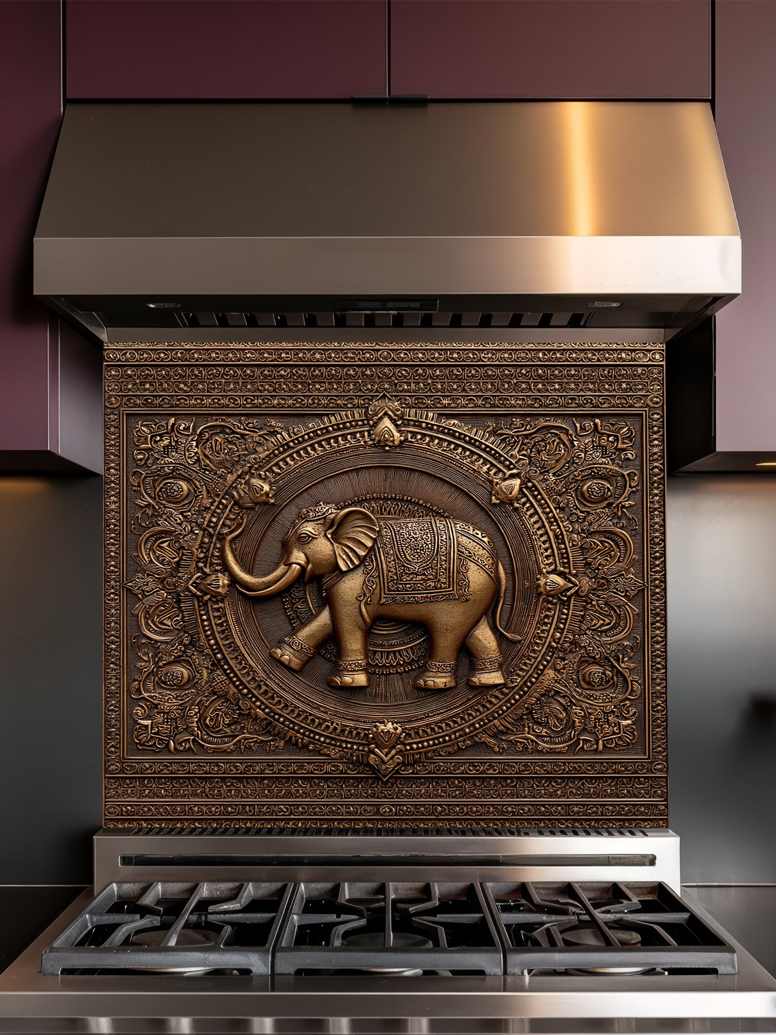 Faux 3D effect intricately carved bronze elephant and ornate mandala pattern, UV printed on a smooth tempered glass kitchen backsplash, installed behind a modern stove.