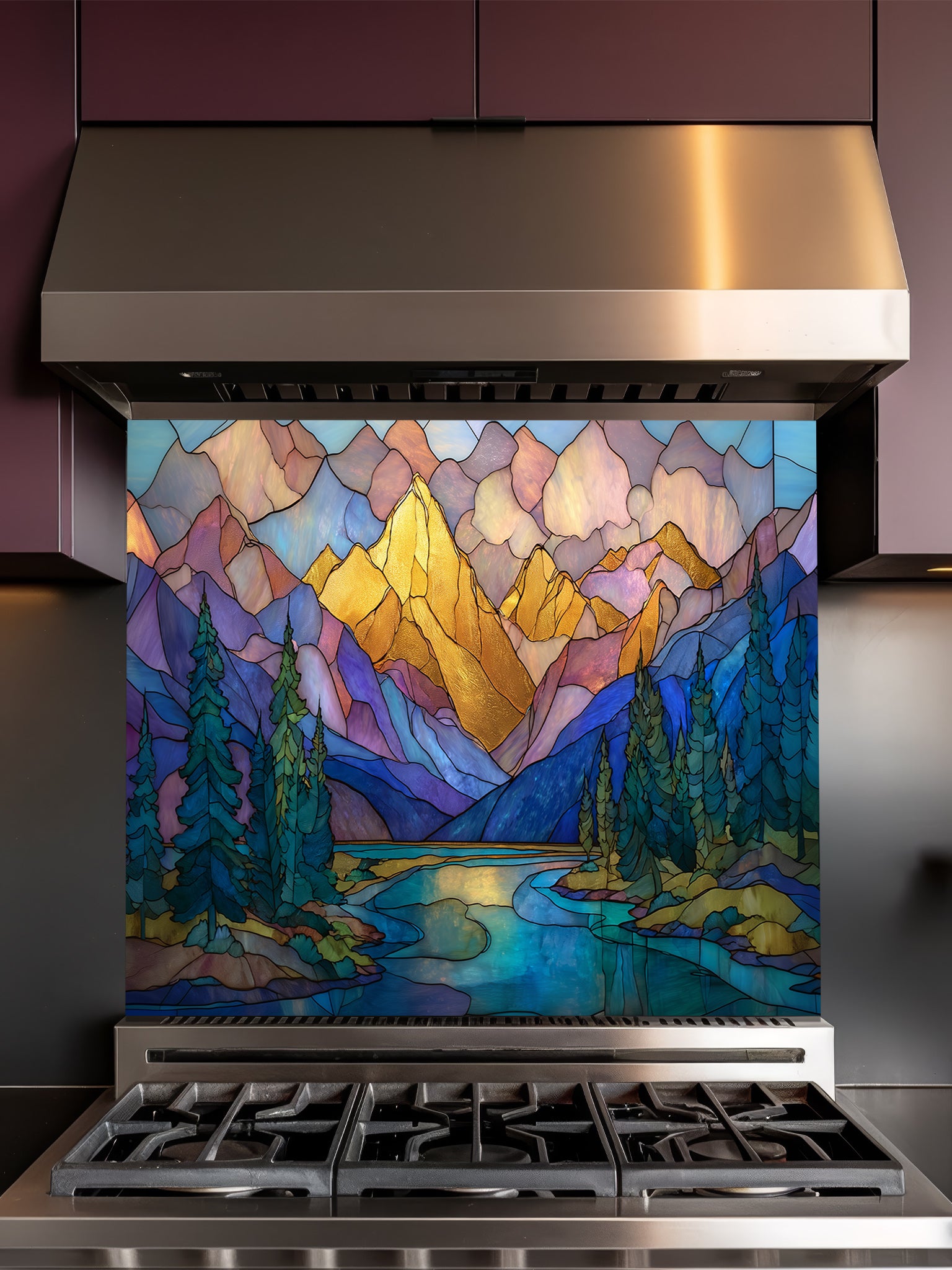 A cozy kitchen featuring a tempered glass backsplash with a beautiful stained glass effect landscape, showcasing majestic mountains, pine trees, and a winding river at sunset, installed behind a modern stainless steel stove.