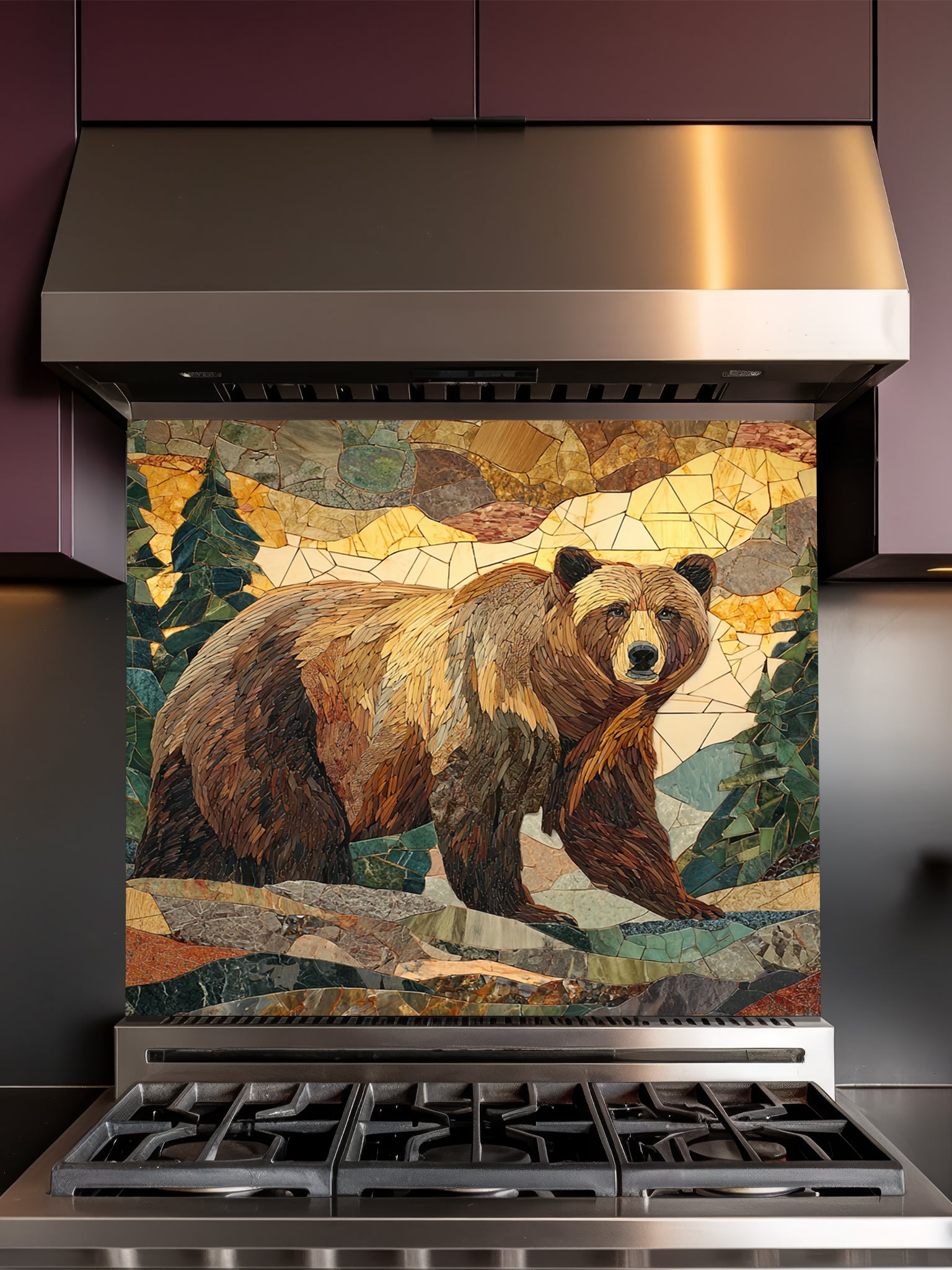Tempered glass kitchen backsplash featuring a highly realistic 3D illusion of a rugged stone mosaic artwork showing a majestic brown bear walking through a forest of pine trees and mountains in earthy brown, green, and golden tones, installed behind a modern black stove.