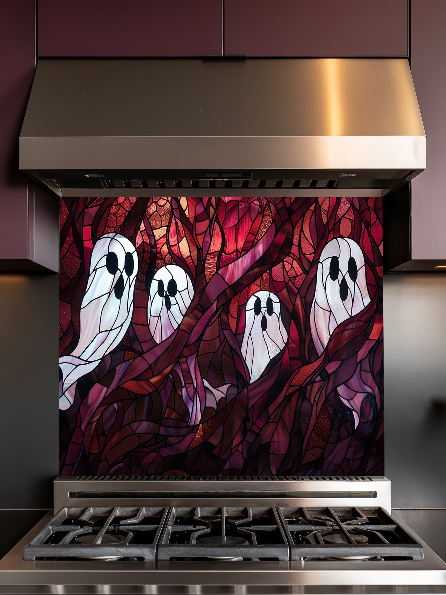 Tempered glass kitchen backsplash featuring a highly realistic 3D illusion of macabre stained glass art showing spooky white ghosts floating among twisted dark red and purple haunted forest branches, installed behind a modern stainless steel stove.