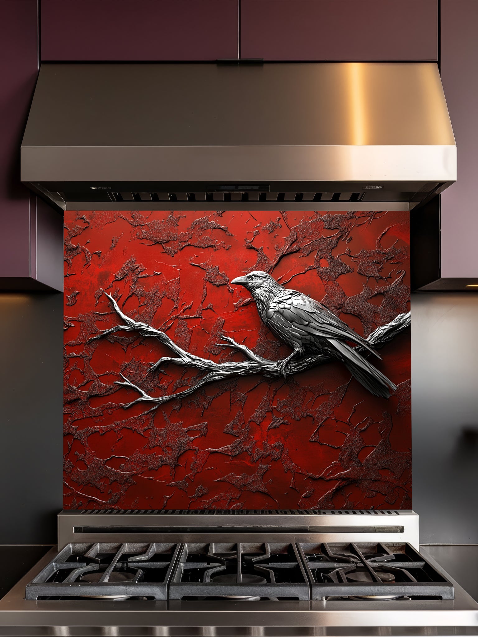 Tempered glass kitchen backsplash featuring a highly realistic 3D illusion of a sculpted metallic black raven perched on a bare branch against a heavily textured, distressed crimson red wall, installed behind a modern black stove.