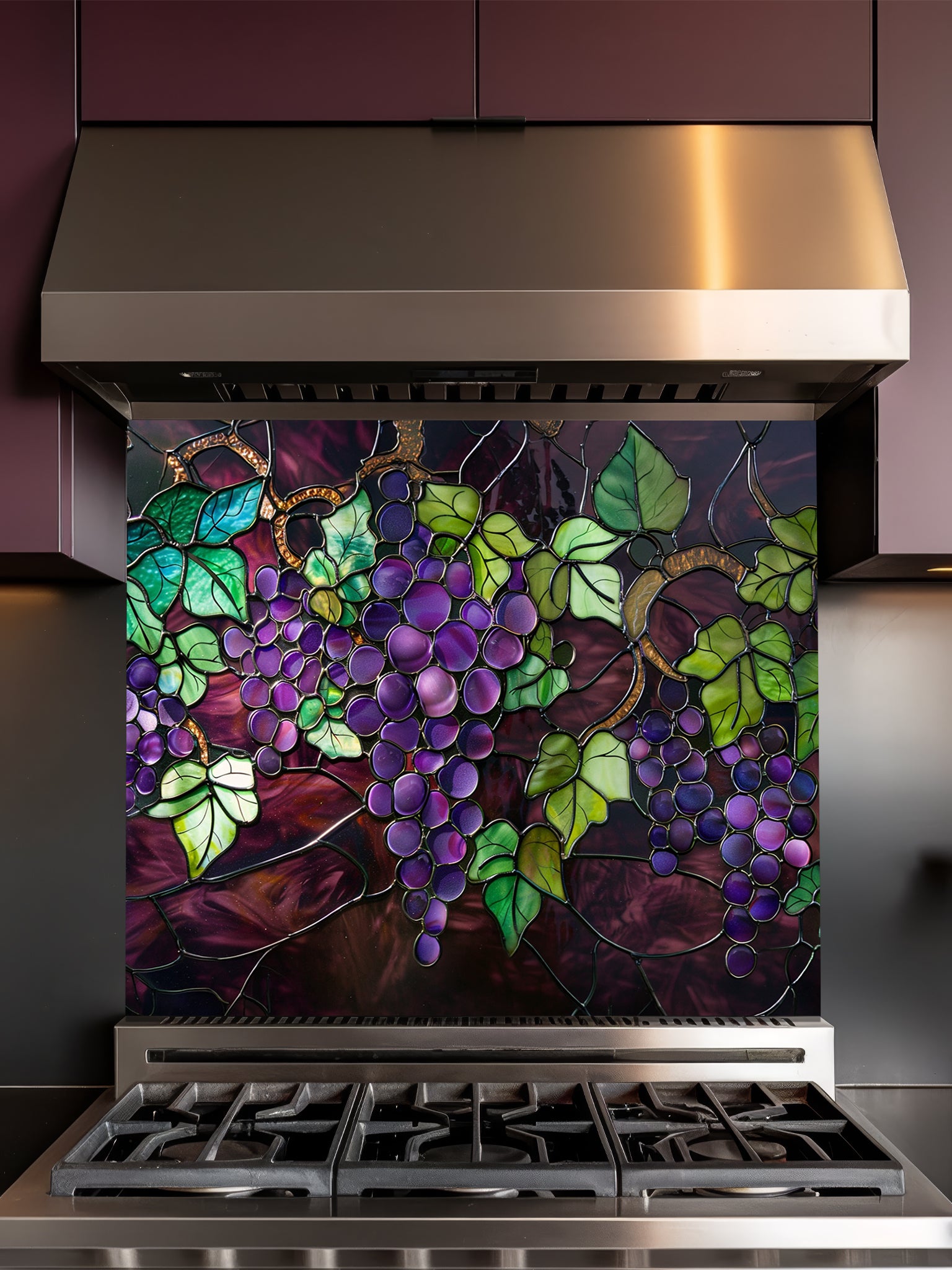 Stained glass style purple grapes and green vine leaves, UV printed on a smooth tempered glass kitchen backsplash, installed behind a modern stove.