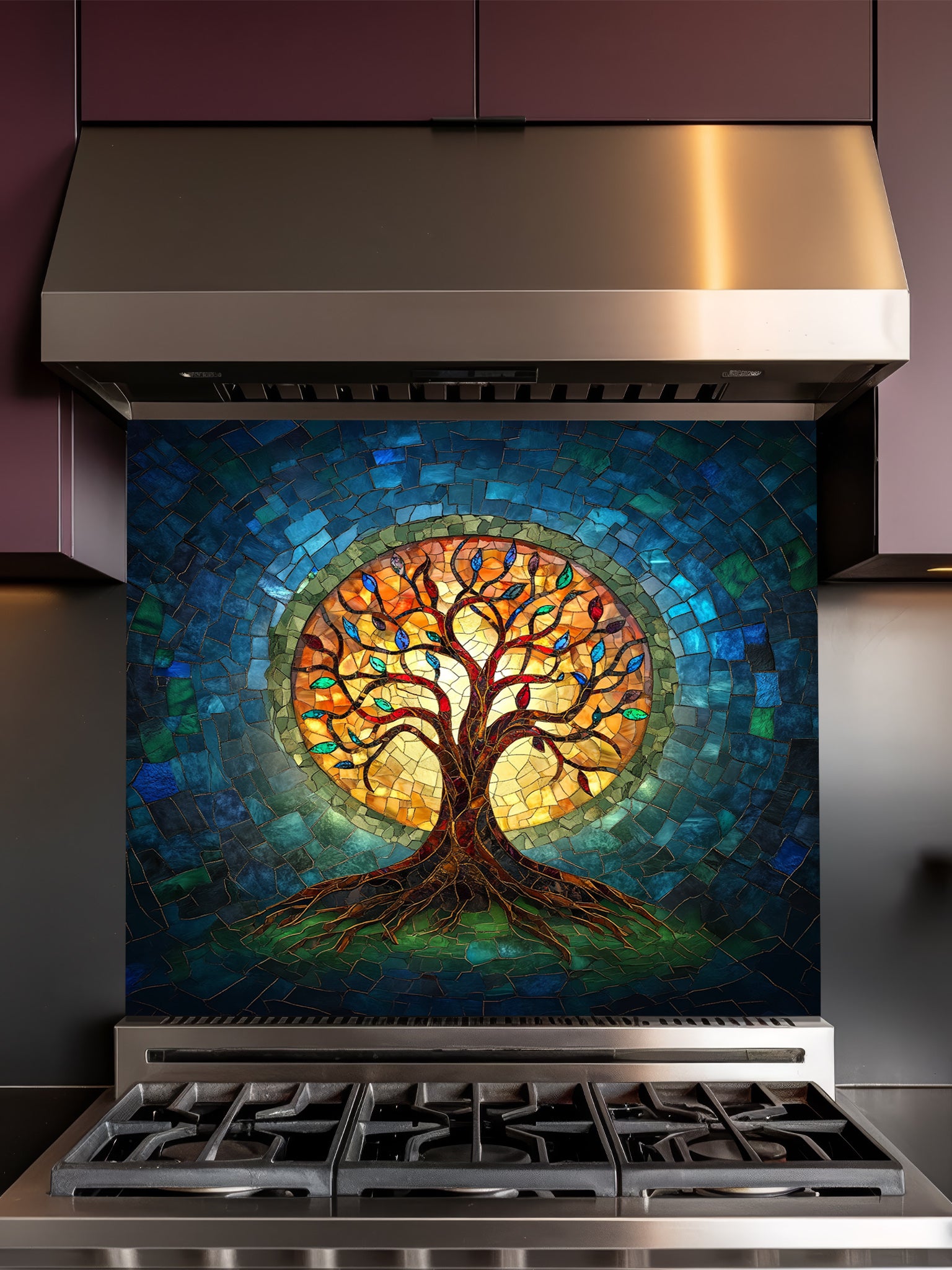 Stained glass mosaic style Tree of Life with vibrant blue, teal, and glowing amber colors, UV printed on a smooth tempered glass kitchen backsplash, installed behind a modern stove.