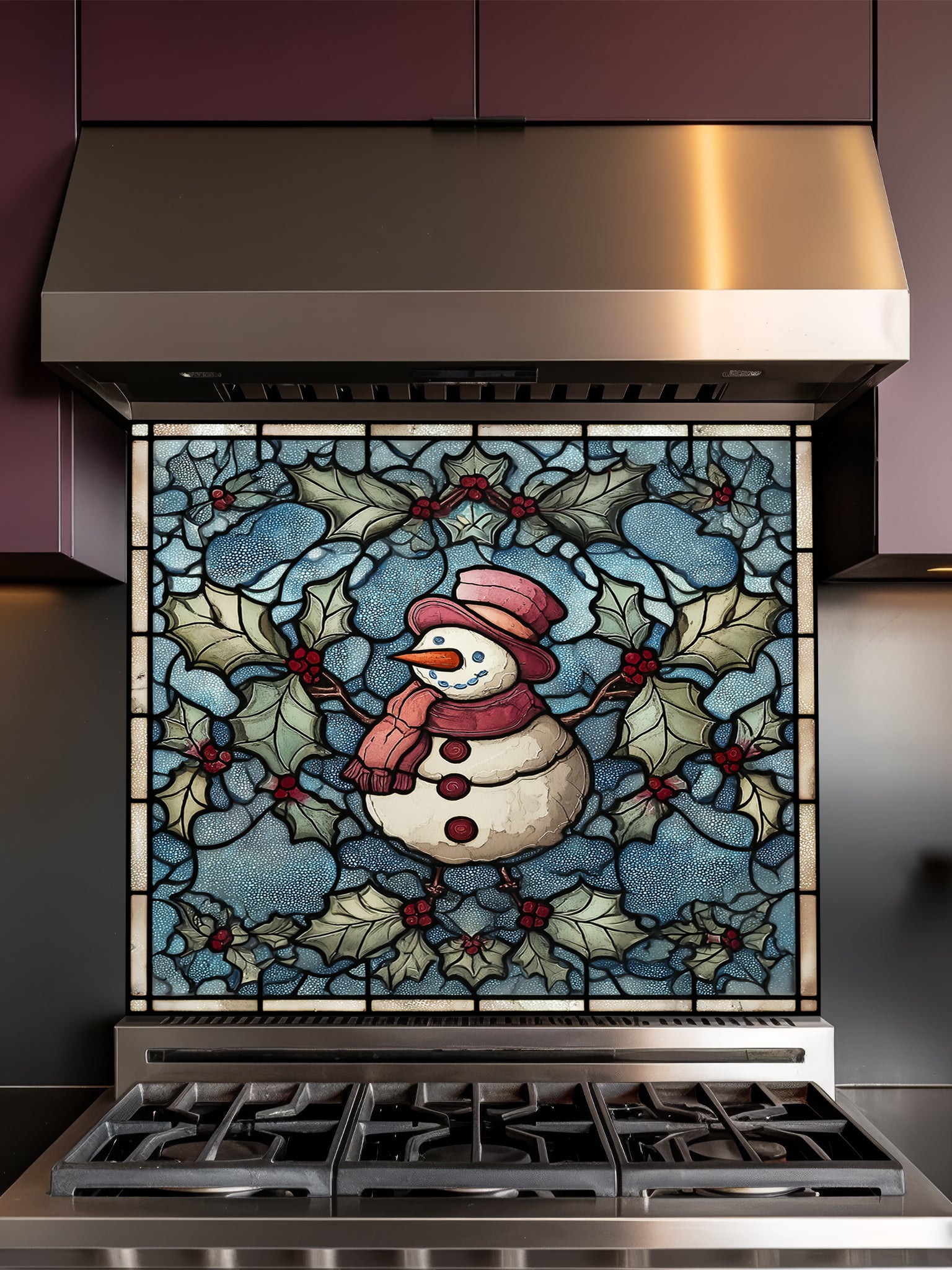Tempered glass kitchen backsplash featuring a highly realistic 3D illusion of stained glass art showing a cheerful snowman with a red hat and scarf surrounded by green winter holly and red berries against a frosted icy blue background, installed behind a modern black stove.