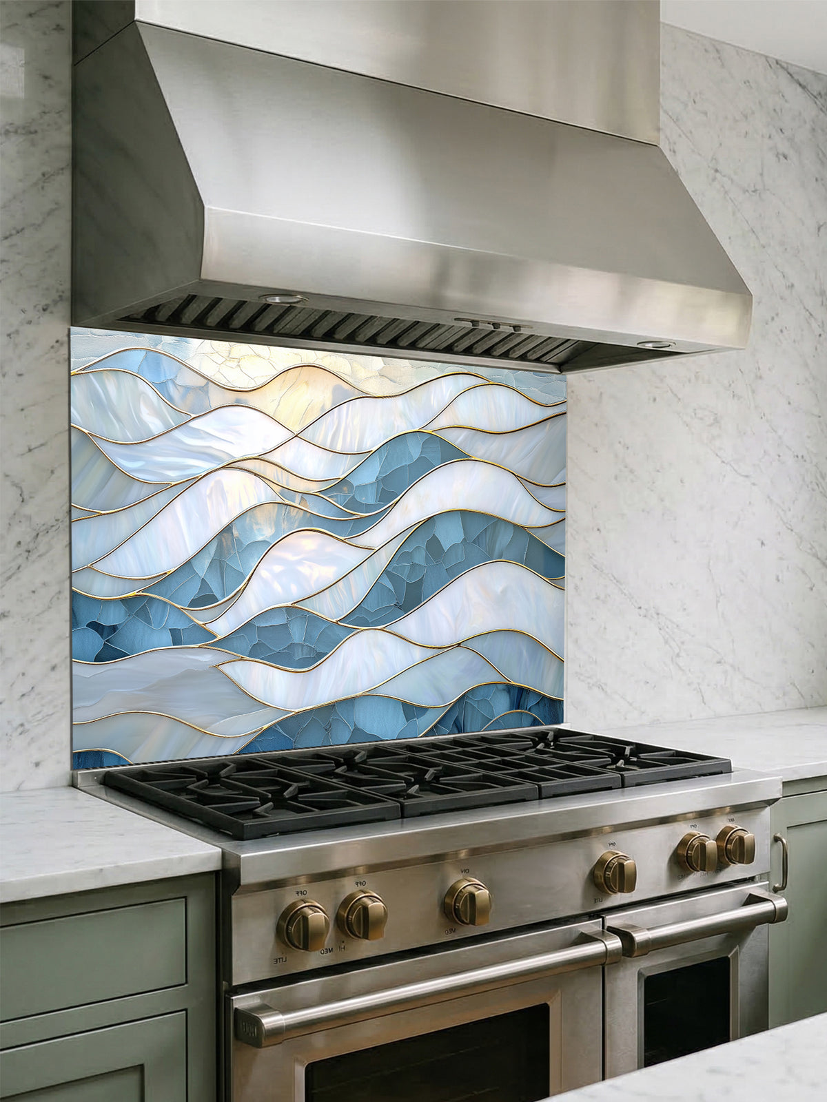 Tempered glass kitchen backsplash featuring a serene faux stained glass design of layered, flowing waves in icy blue and pearlescent white, separated by elegant gold outlines, installed behind a modern stainless steel stove.