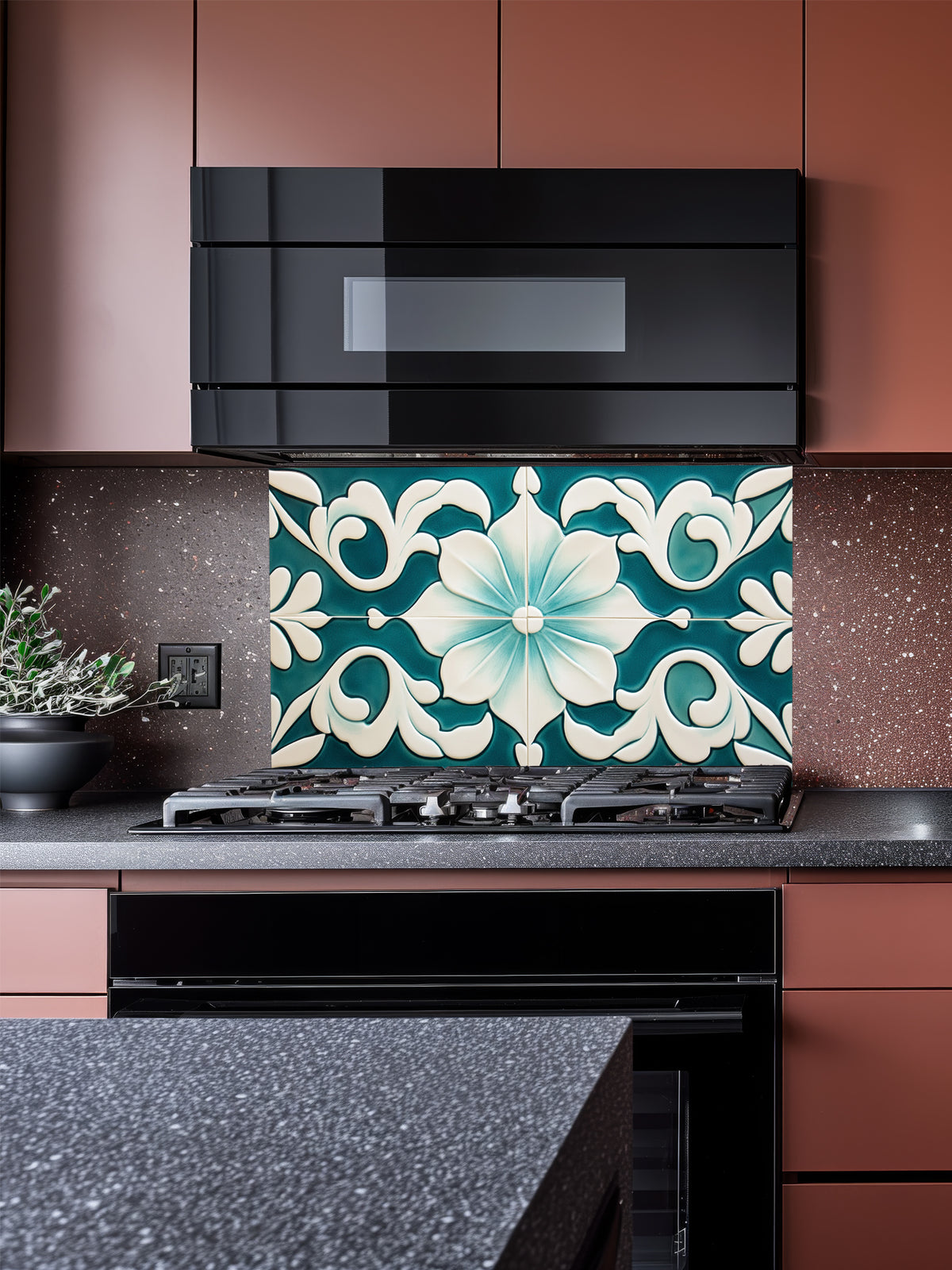 Tempered glass kitchen backsplash featuring a highly realistic illusion of traditional Mediterranean or Talavera tiles, showcasing a large, elegant floral or lotus pattern in deep teal and creamy ivory, installed behind a modern black stove.