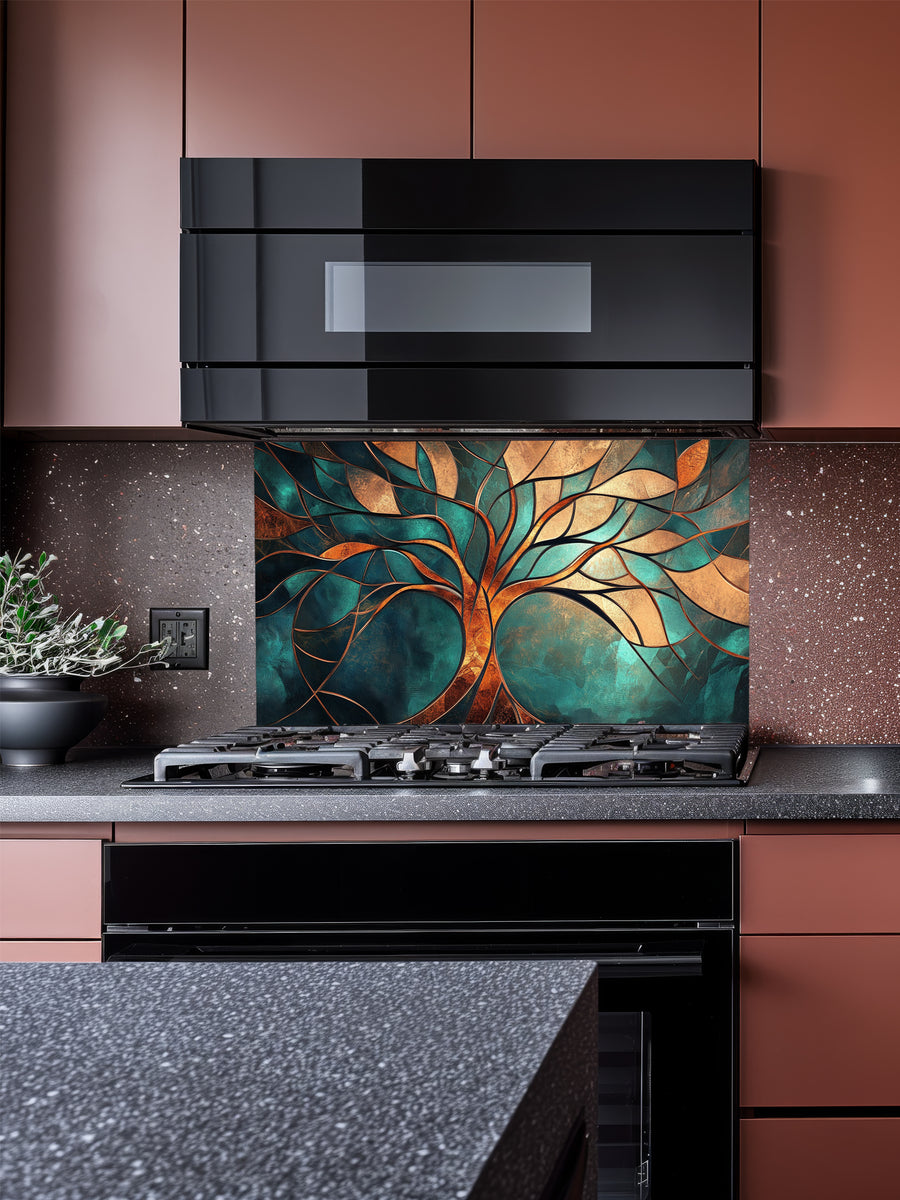 Tempered glass kitchen backsplash featuring a highly realistic 3D illusion of a stained glass and metallic Tree of Life with glowing gold, bronze, and copper branches against a rich teal and emerald background, installed behind a modern black stove.
