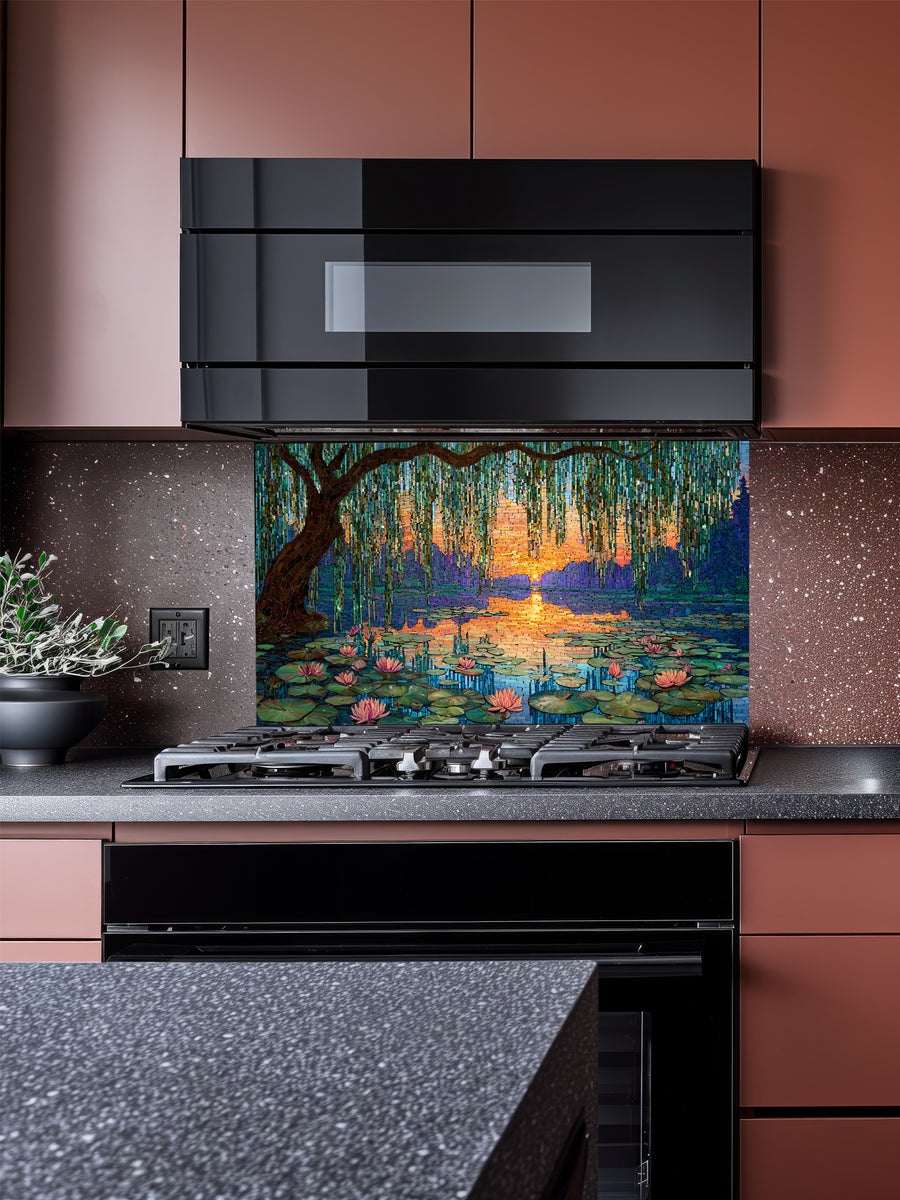 Tempered glass kitchen backsplash featuring a highly realistic 3D illusion of intricate mosaic tile art showing a majestic weeping willow tree and blooming pink water lilies on a tranquil lake during a vibrant golden and purple sunset, installed behind a modern black stove.