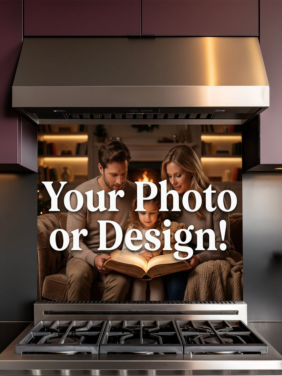 Tempered glass kitchen backsplash showcasing a custom 'Your Photo or Design' mockup featuring a family reading by a fireplace, installed behind a modern stainless steel stove.