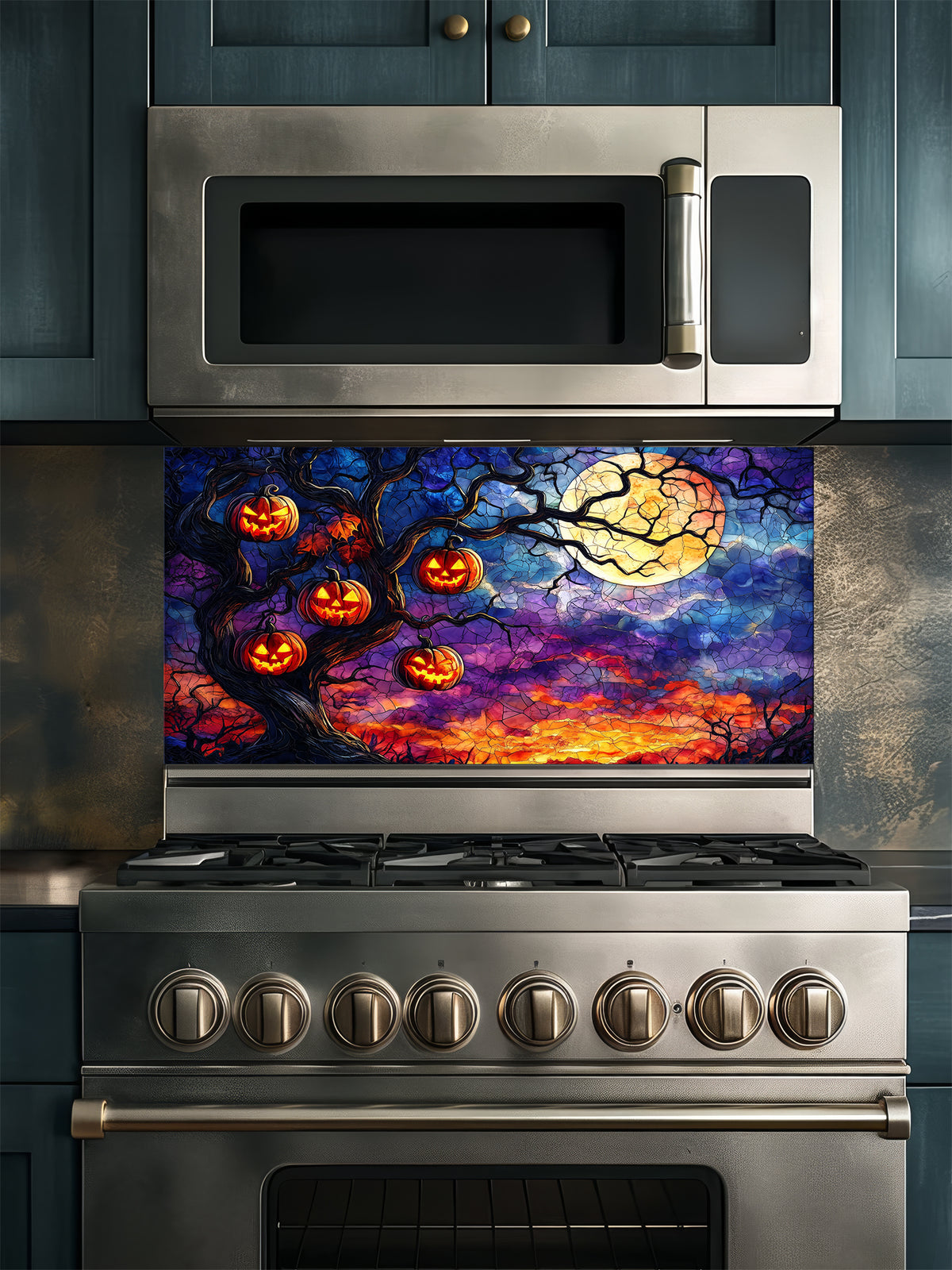Stainless steel oven with Halloween-themed decorative glass backsplash