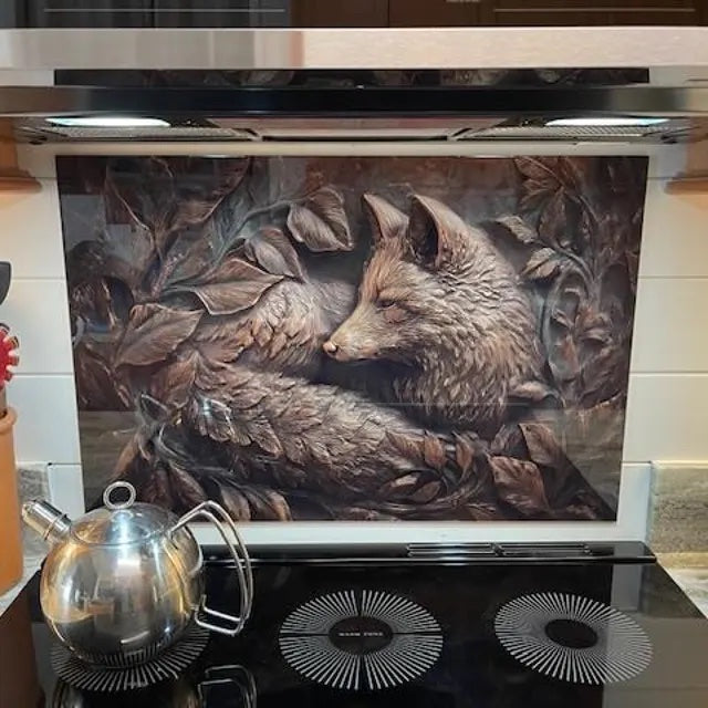 Customer kitchen with a copper look 3D fox tempered glass backsplash behind a black cooktop