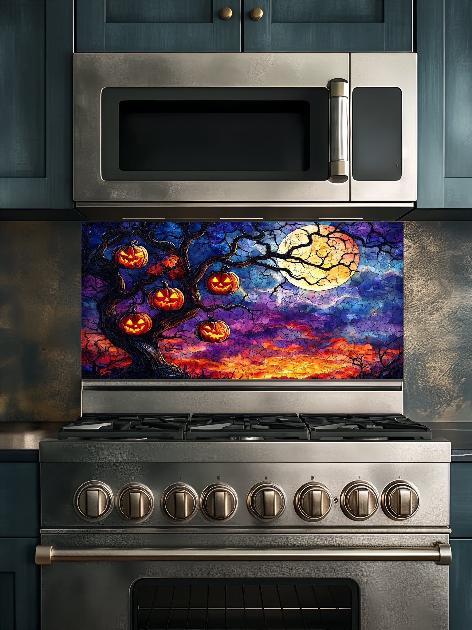 Stainless steel oven with Halloween-themed decorative glass backsplash