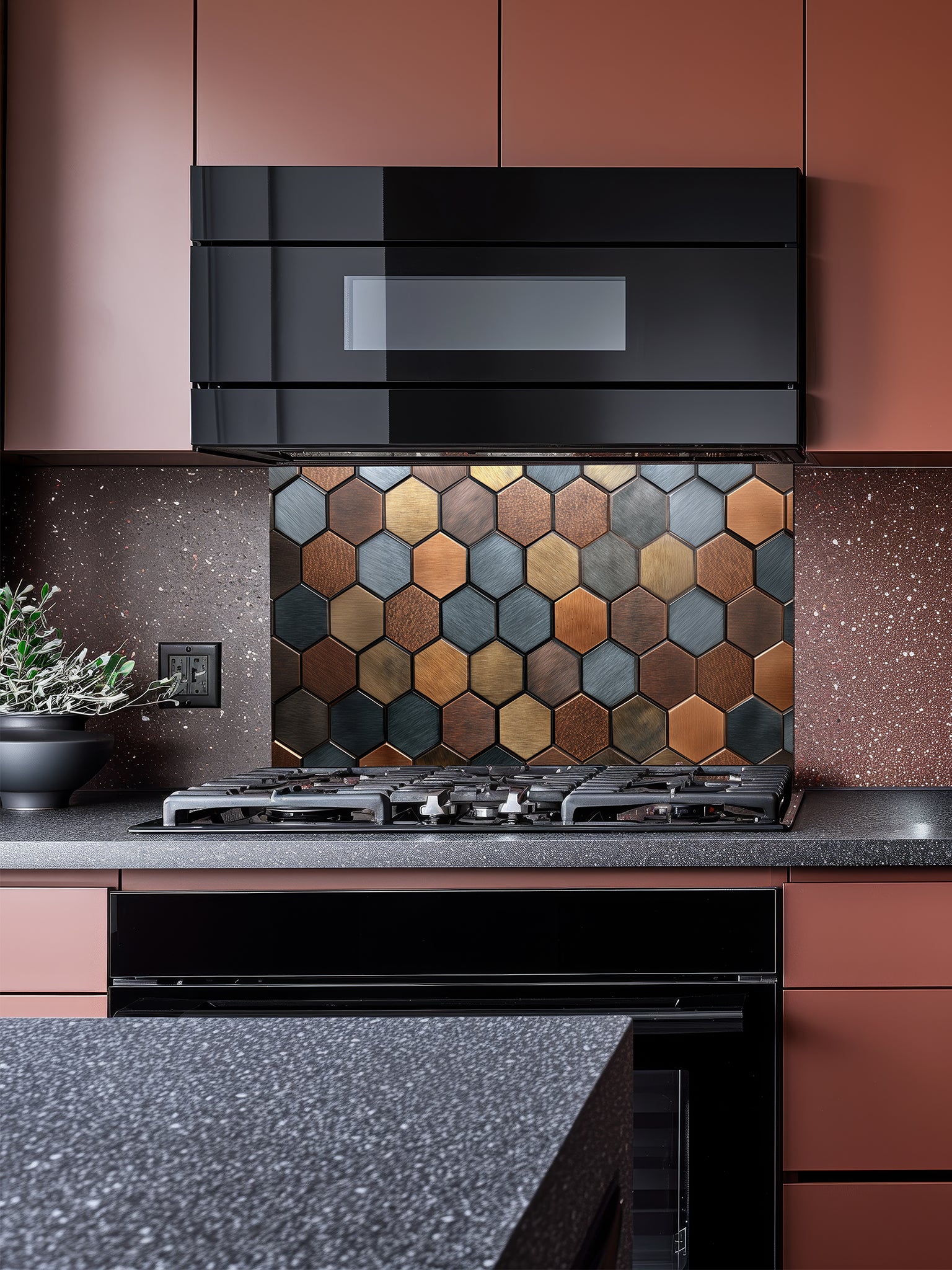 Tempered glass kitchen backsplash featuring a modern metallic hexagon honeycomb pattern in rich copper, bronze, and slate blue tones, installed behind a stainless steel stove.