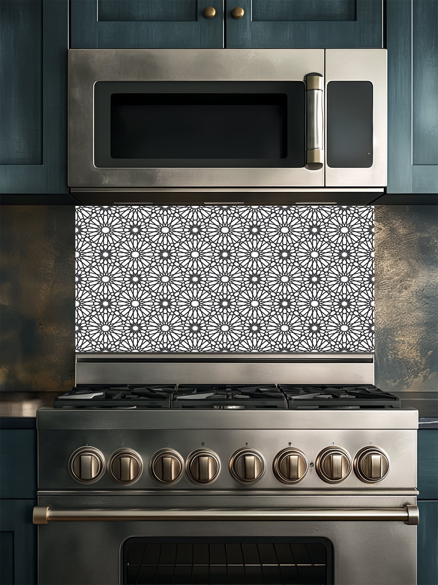 Stainless steel microwave and oven with decorative backsplash in a kitchen setting