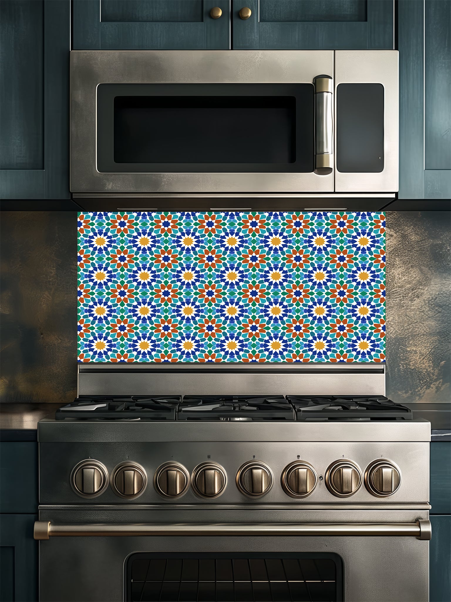 Stainless steel microwave and oven with colorful geometric patterned backsplash in a kitchen setting.