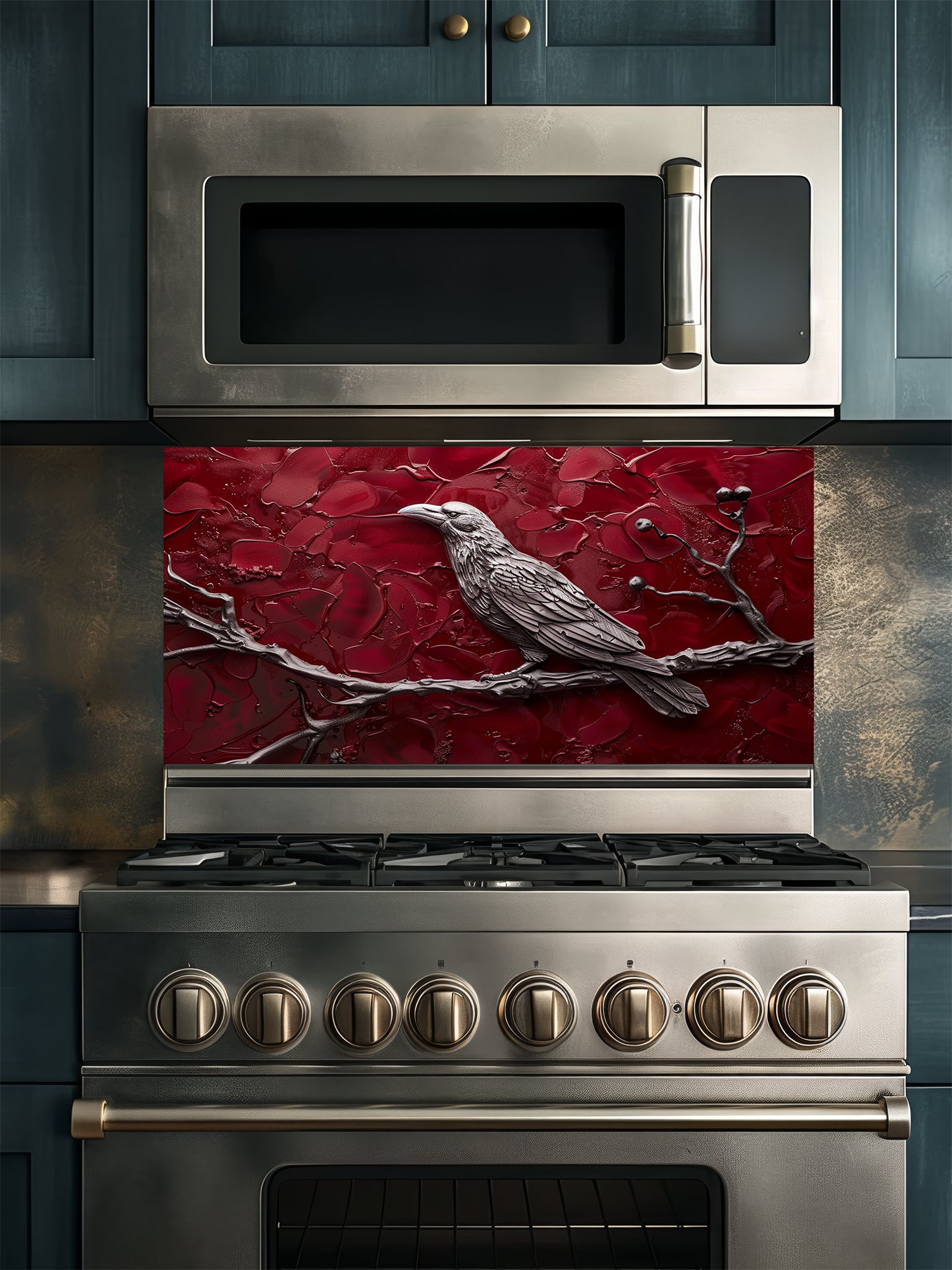 Tempered glass kitchen backsplash featuring a highly realistic 3D illusion of a sculpted metallic raven perched on a branch with berries against a heavily textured, thick impasto crimson red background, installed behind a modern black stove.