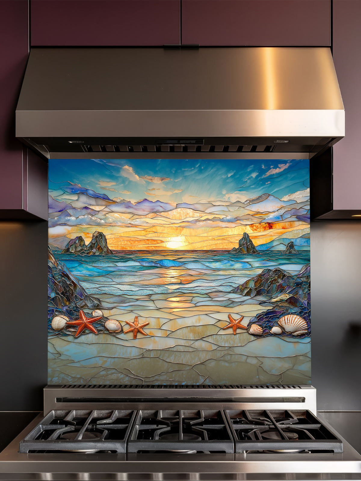 Stained glass style beach sunset with ocean waves, rocky cliffs, seashells, and starfish, UV printed on a smooth tempered glass kitchen backsplash, installed behind a modern stove.