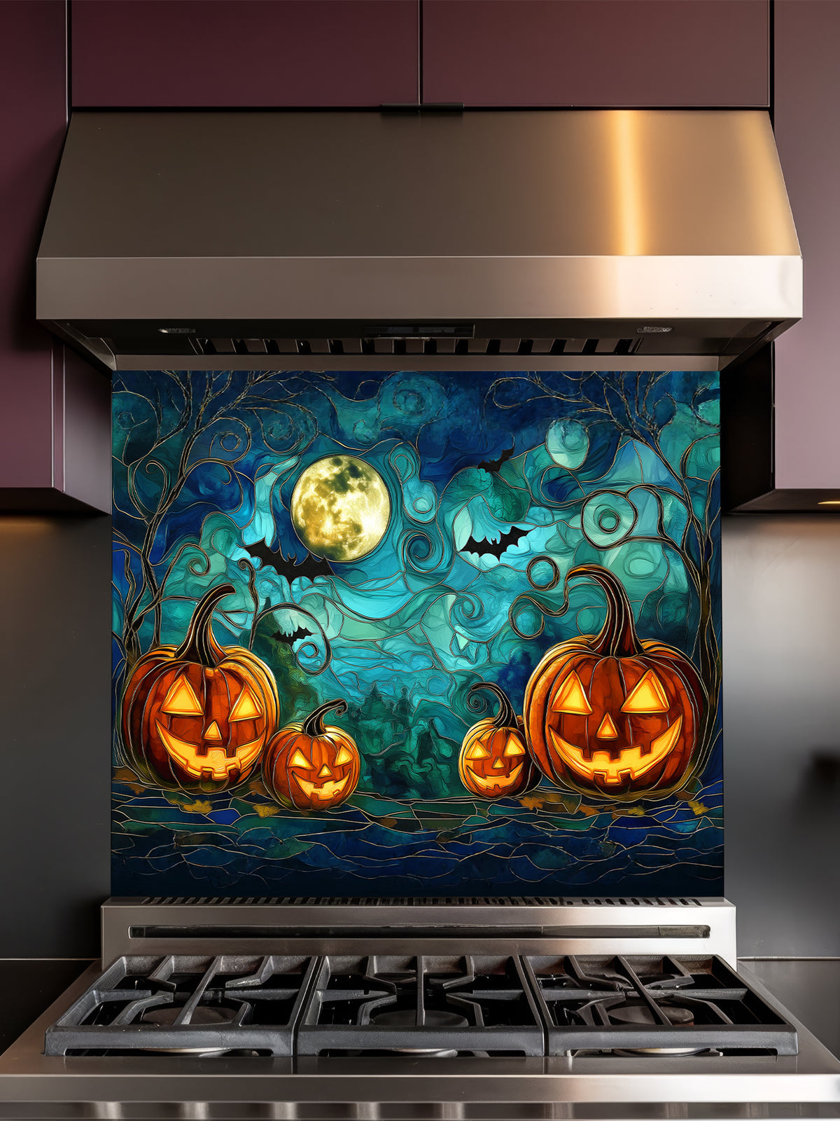 A festive kitchen featuring a tempered glass backsplash with a spooky stained glass effect illustration showing glowing Halloween pumpkins, bats, and a full moon, installed behind a metallic gray stove.